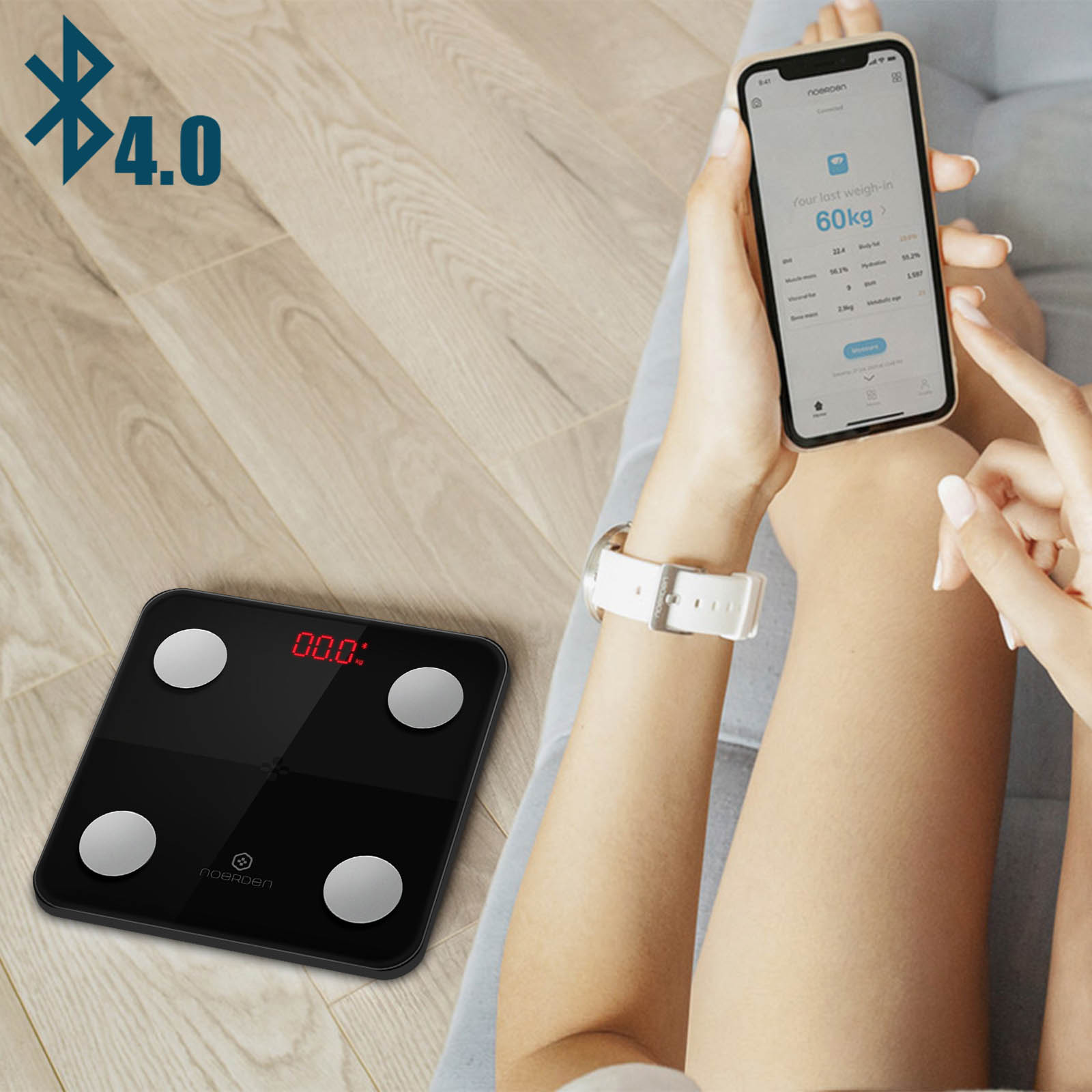 Schwarze Waage mit Telefon, das Gewicht anzeigt. Bluetooth-Symbol oben links.