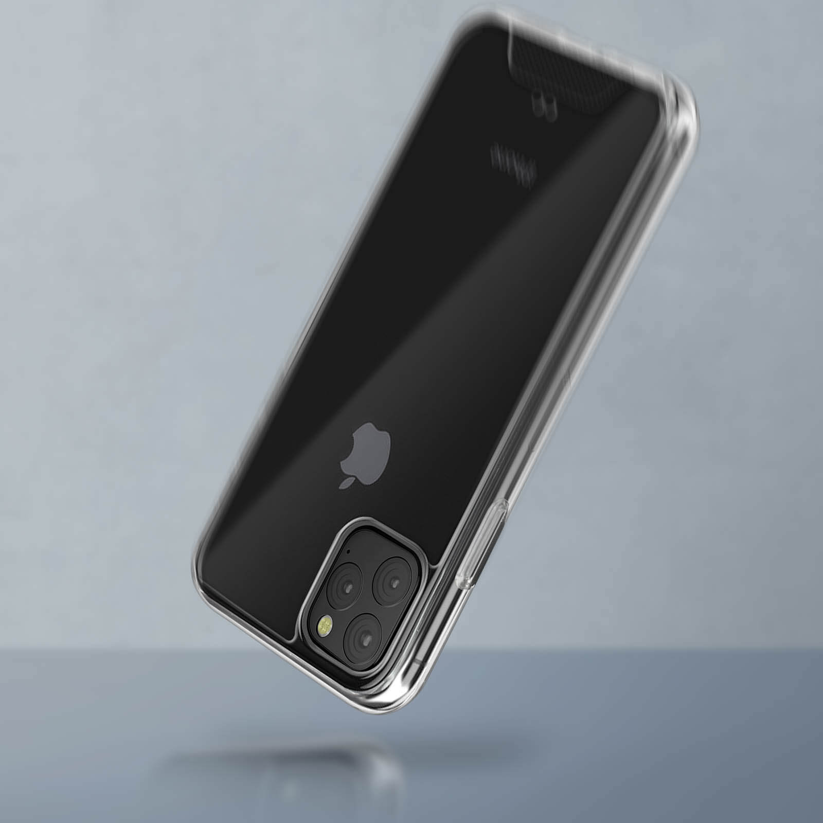 Custodia trasparente per telefono su un telefono nero. Logo Apple visibile. La custodia è sospesa a mezz'aria su sfondo grigio.