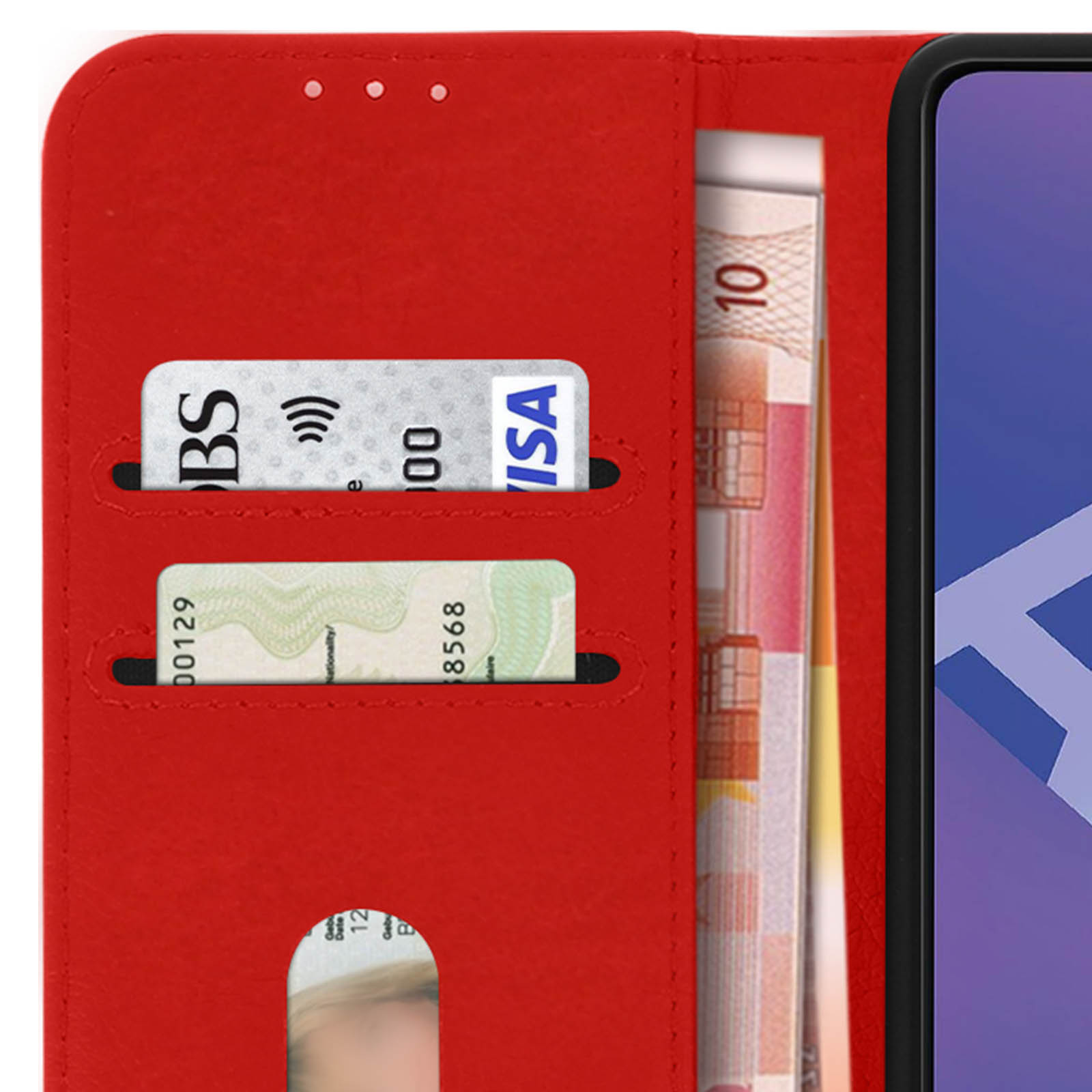 Un étui de téléphone rouge avec des cartes et de l'argent à l'intérieur, ouvert. Gros plan.