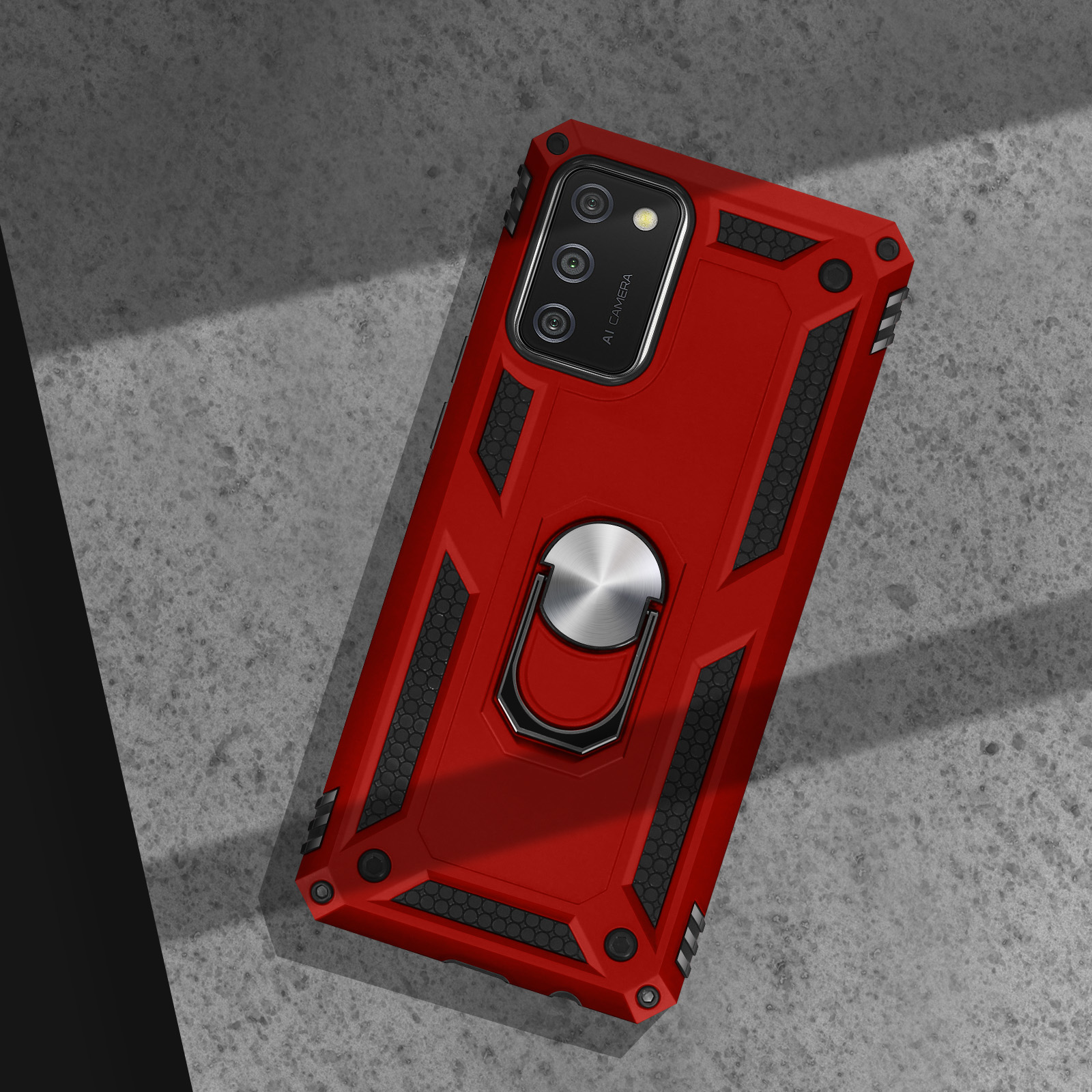 Una custodia rossa per telefono con supporto ad anello è su una superficie. L'area della fotocamera è visibile.