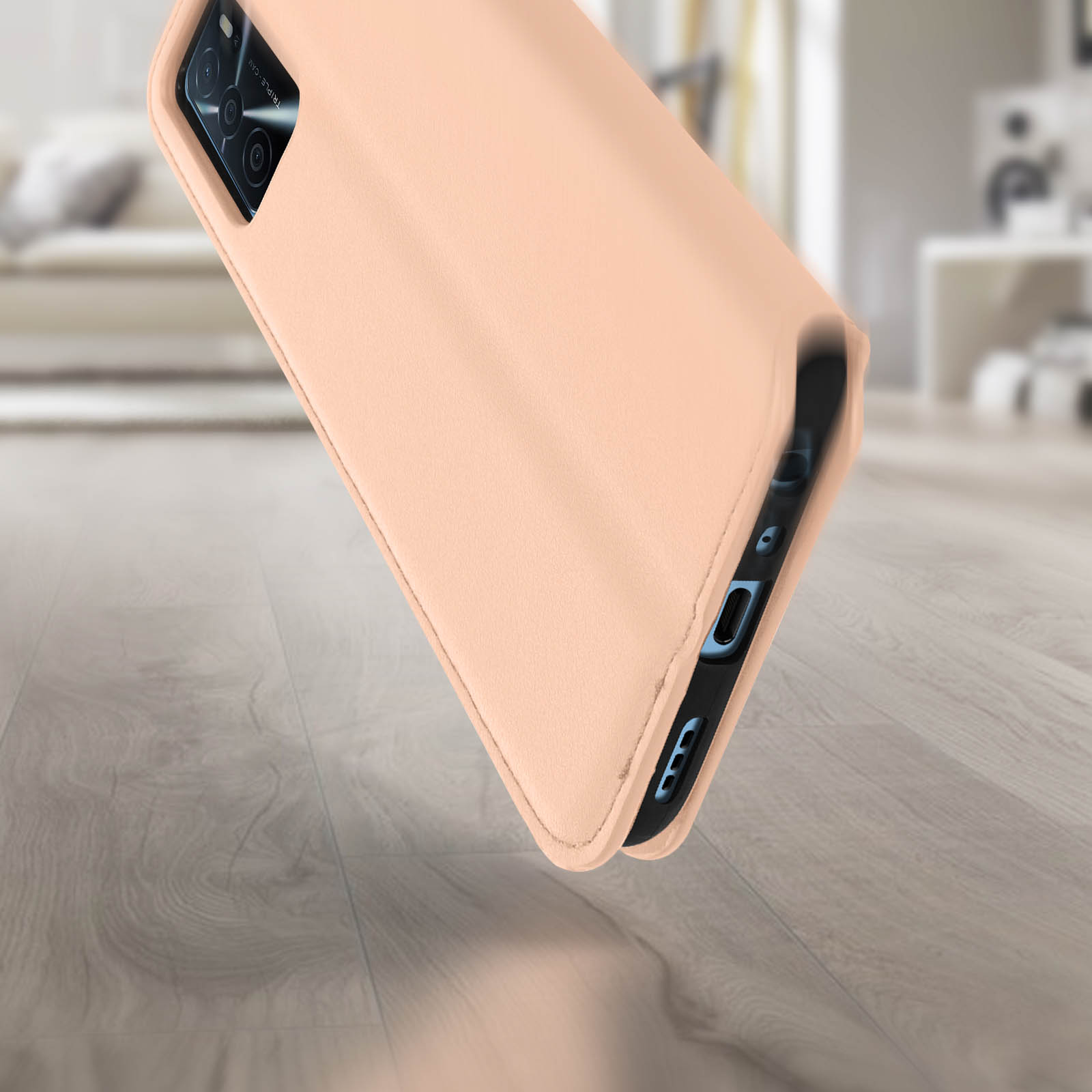 Telefono in custodia rosa chiaro. Il lato del telefono è visibile, con la custodia aperta.