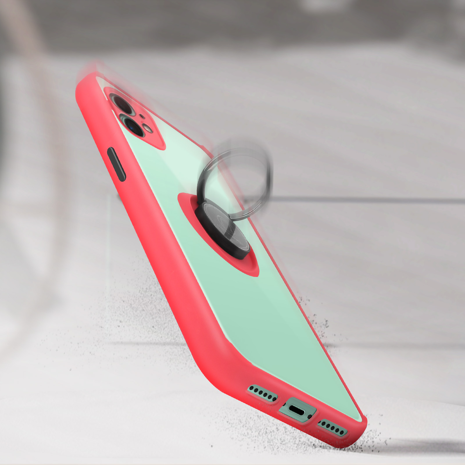 Coque rouge et transparente avec anneau, tombant. Fond blanc.