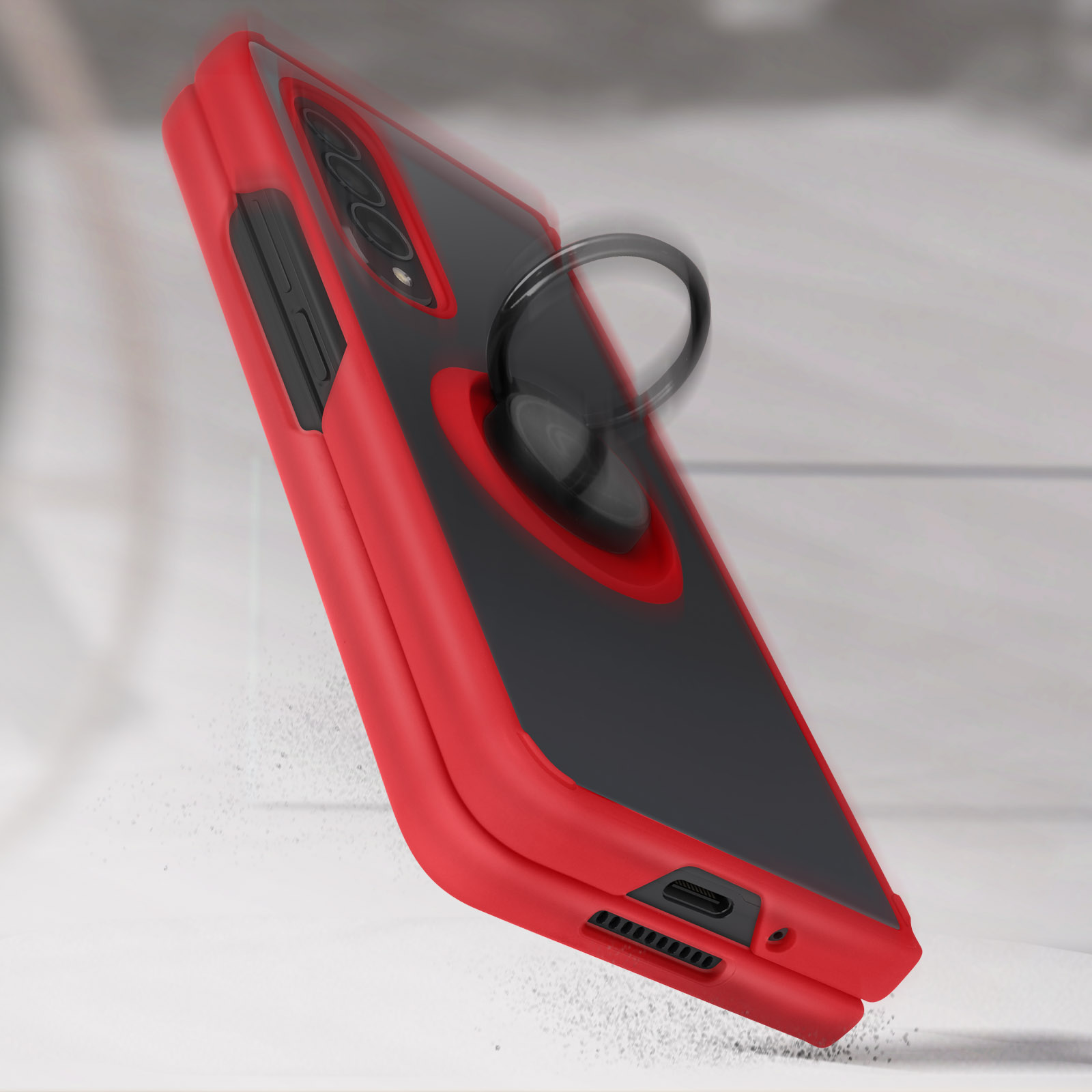 Coque de téléphone rouge et noire avec anneau, en angle, sur fond blanc.
