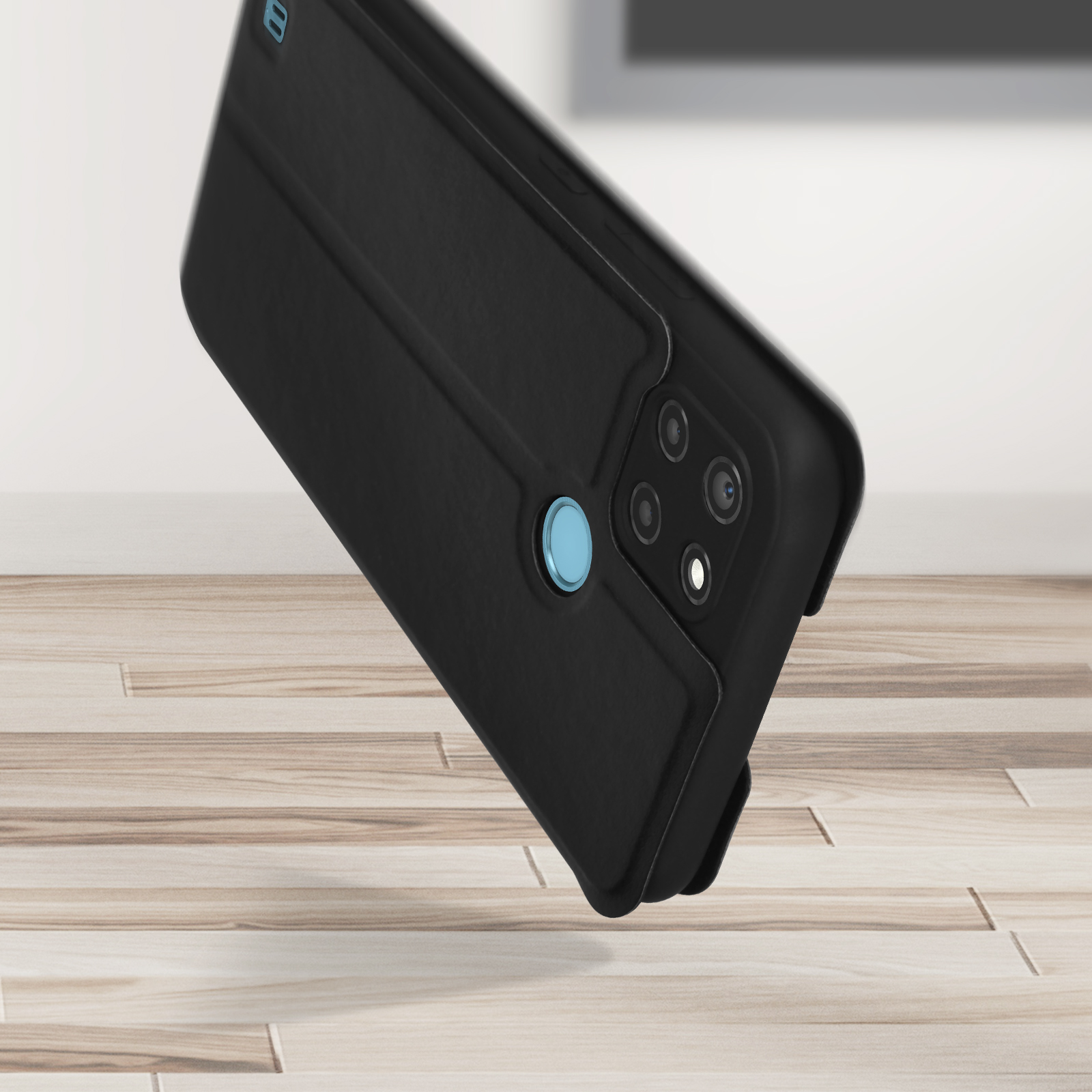 Custodia nera per telefono con un cerchio azzurro, con telefono all'interno, su superficie in legno.