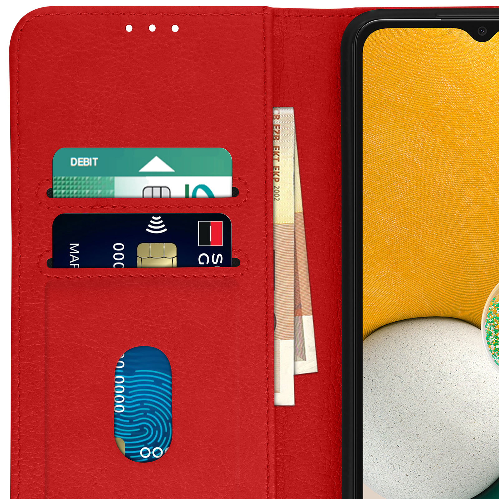 Étui de téléphone rouge ouvert, montrant cartes et argent à côté du téléphone.