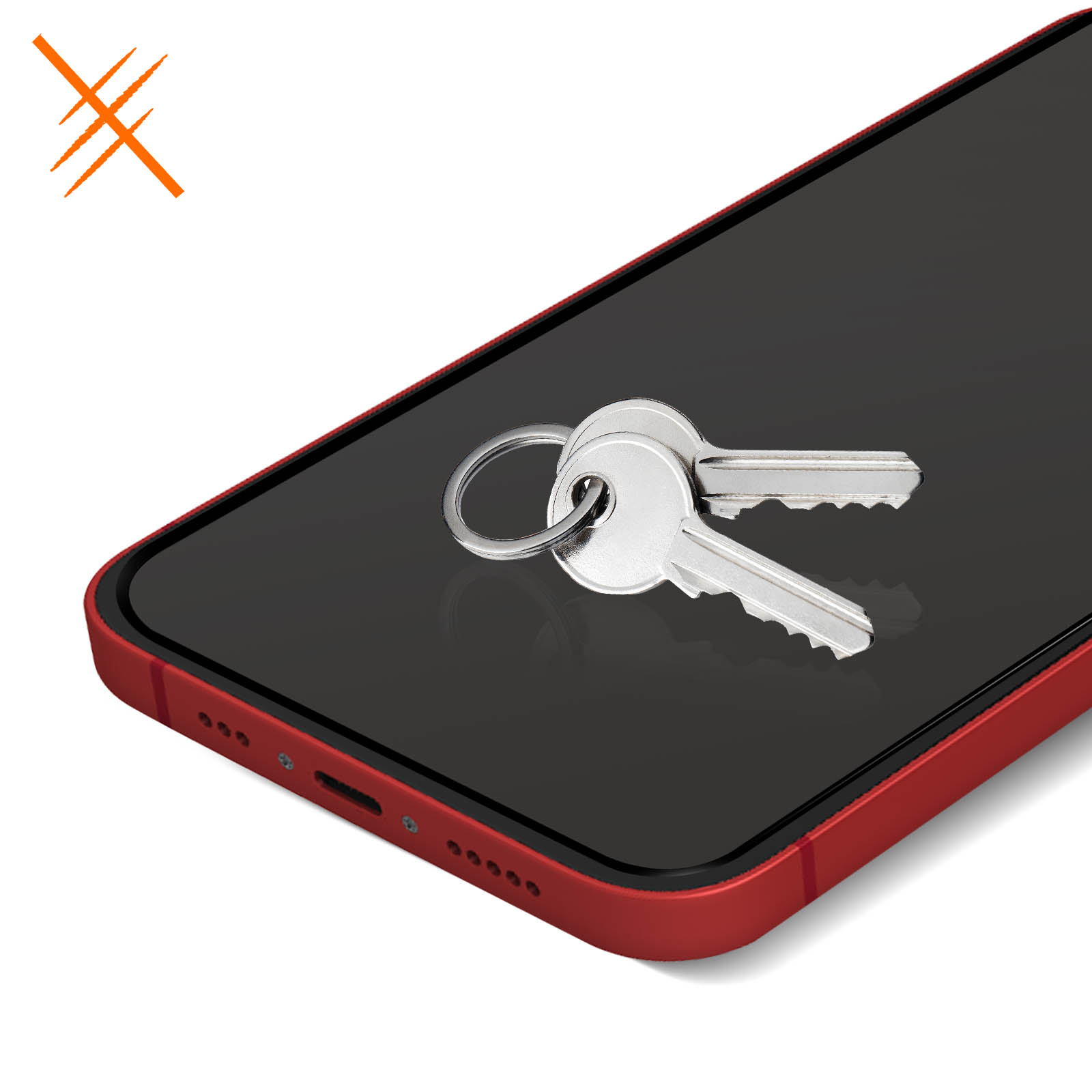 Due chiavi appoggiate sopra un telefono rosso. Il telefono è su una superficie bianca.