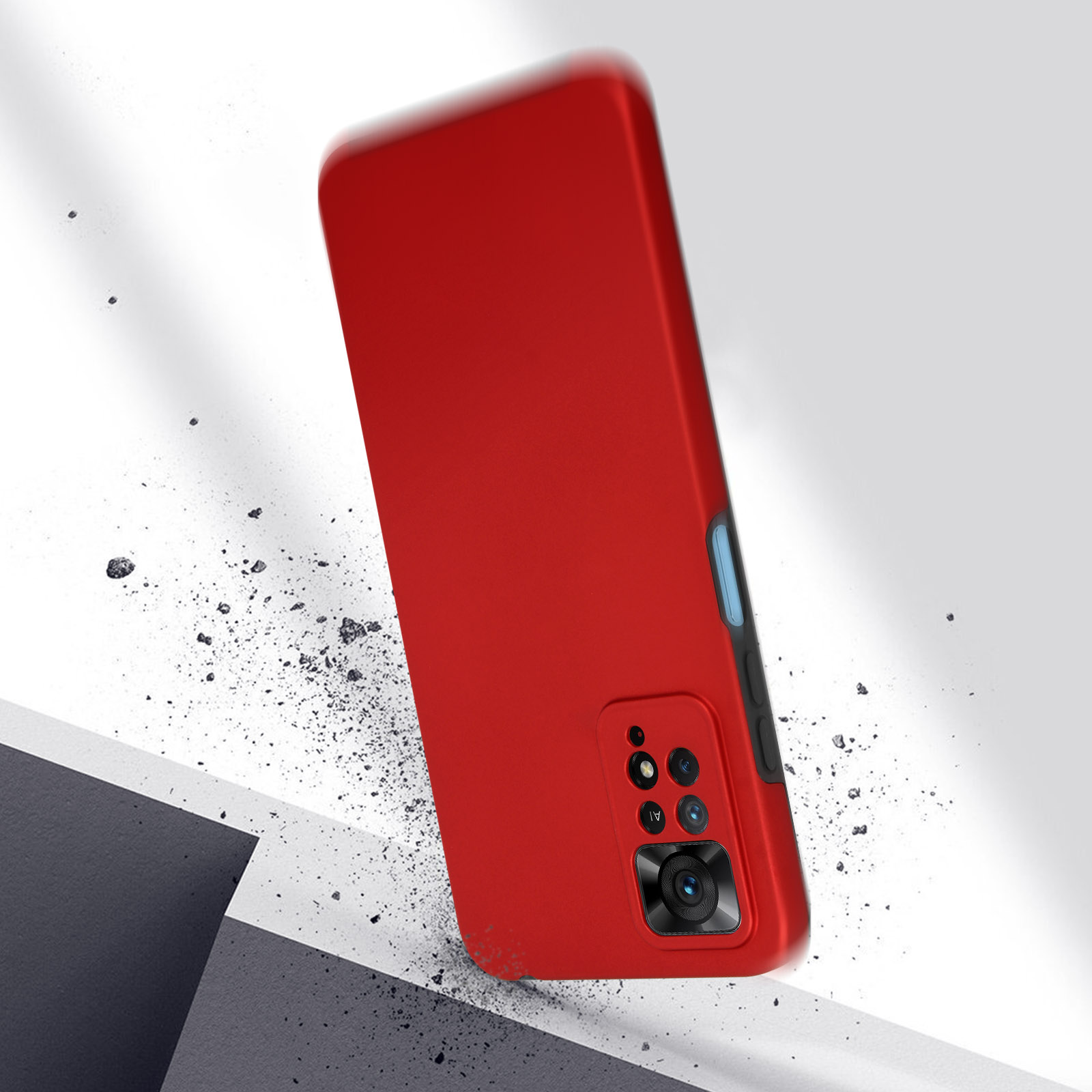 Coque de téléphone rouge avec une caméra. La coque du téléphone tombe. Il y a des pierres.