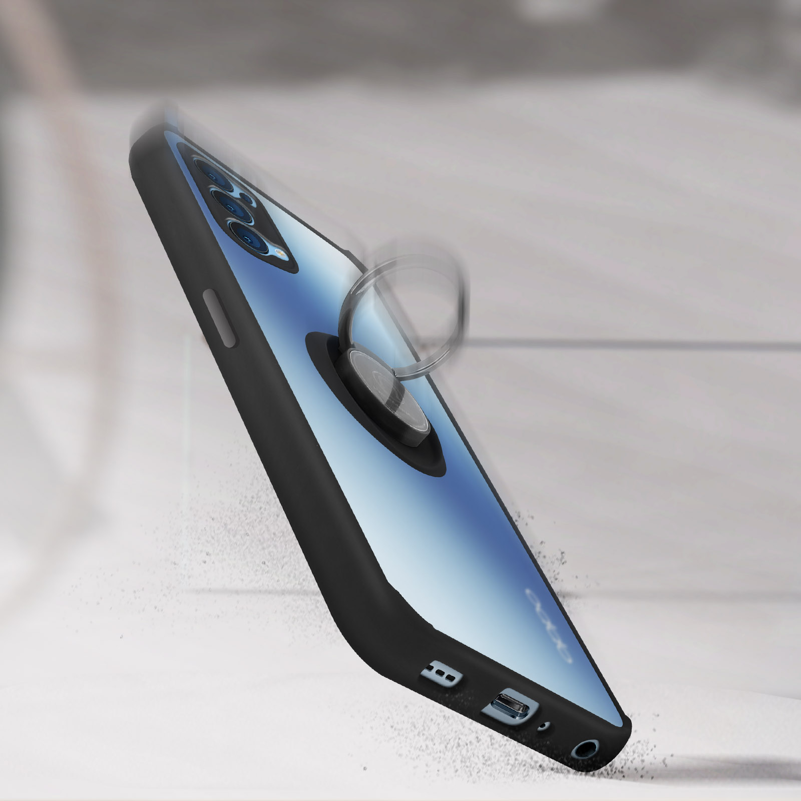 Telefono con custodia con anello, inclinato, con polvere che cade intorno.