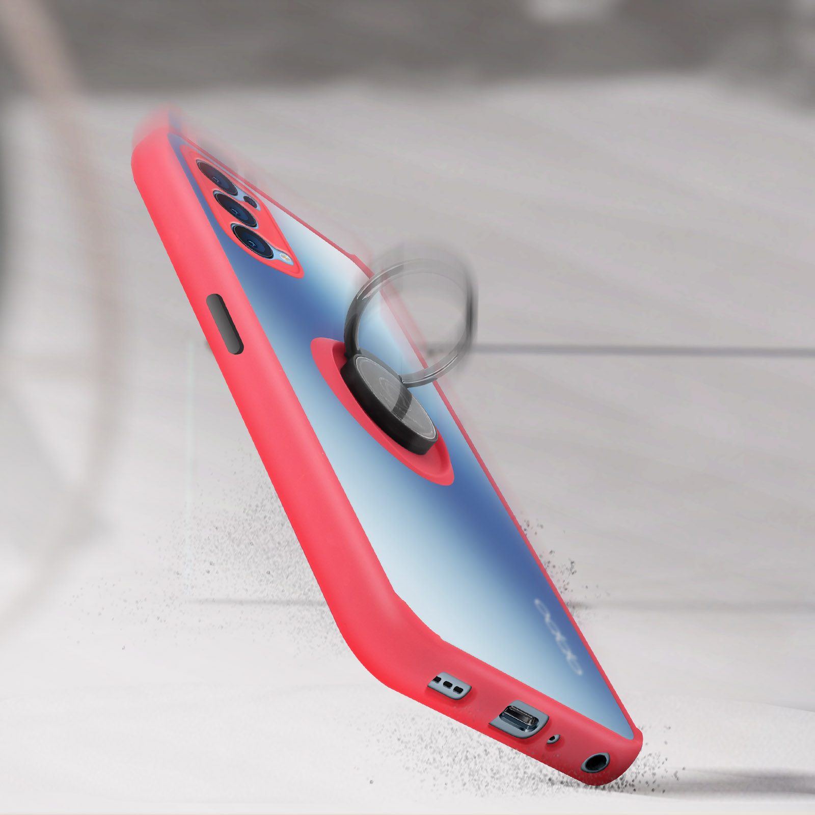 Telefono in una custodia con un anello, che cade con detriti. Rosso e blu.