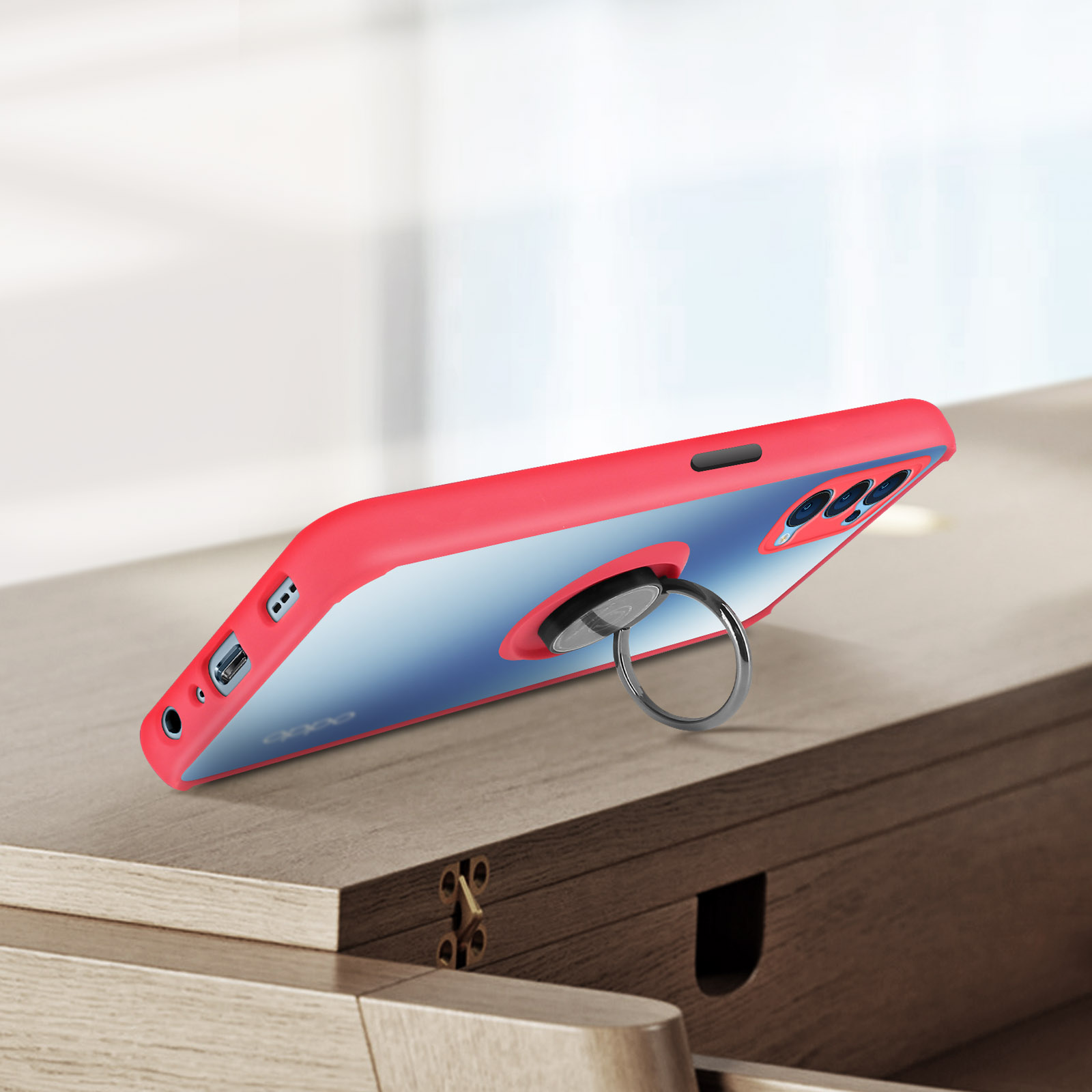 Custodia rossa per telefono con anello. Sfondo sfumato rosa e blu.