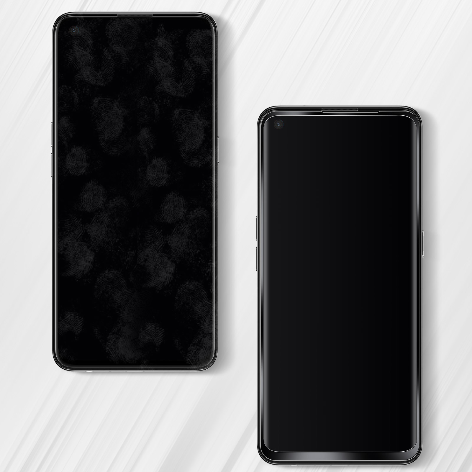Due smartphone neri su una superficie bianca. Uno ha impronte digitali, l'altro è pulito.