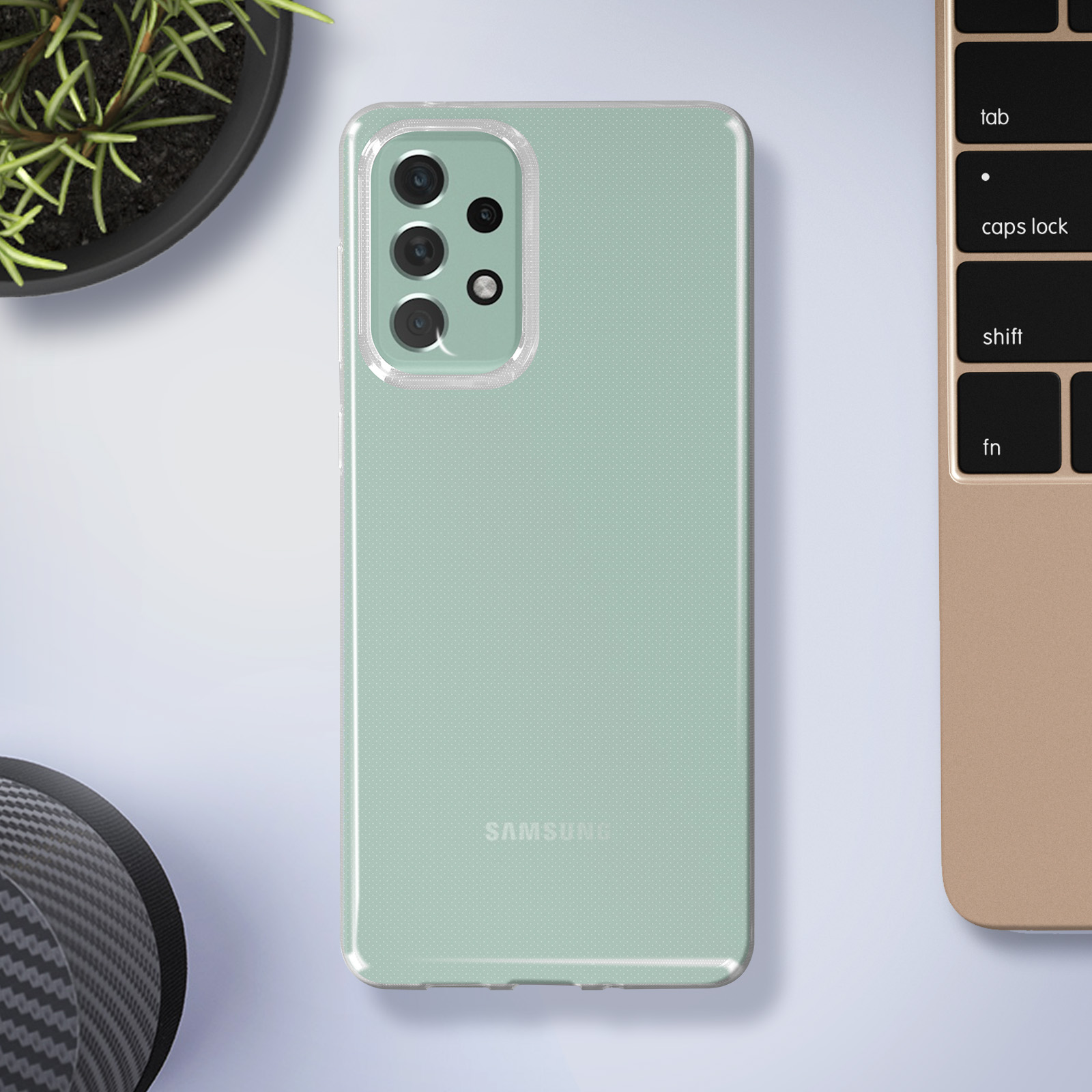 Custodia verde menta per telefono con un telefono all'interno, su una scrivania con una tastiera.