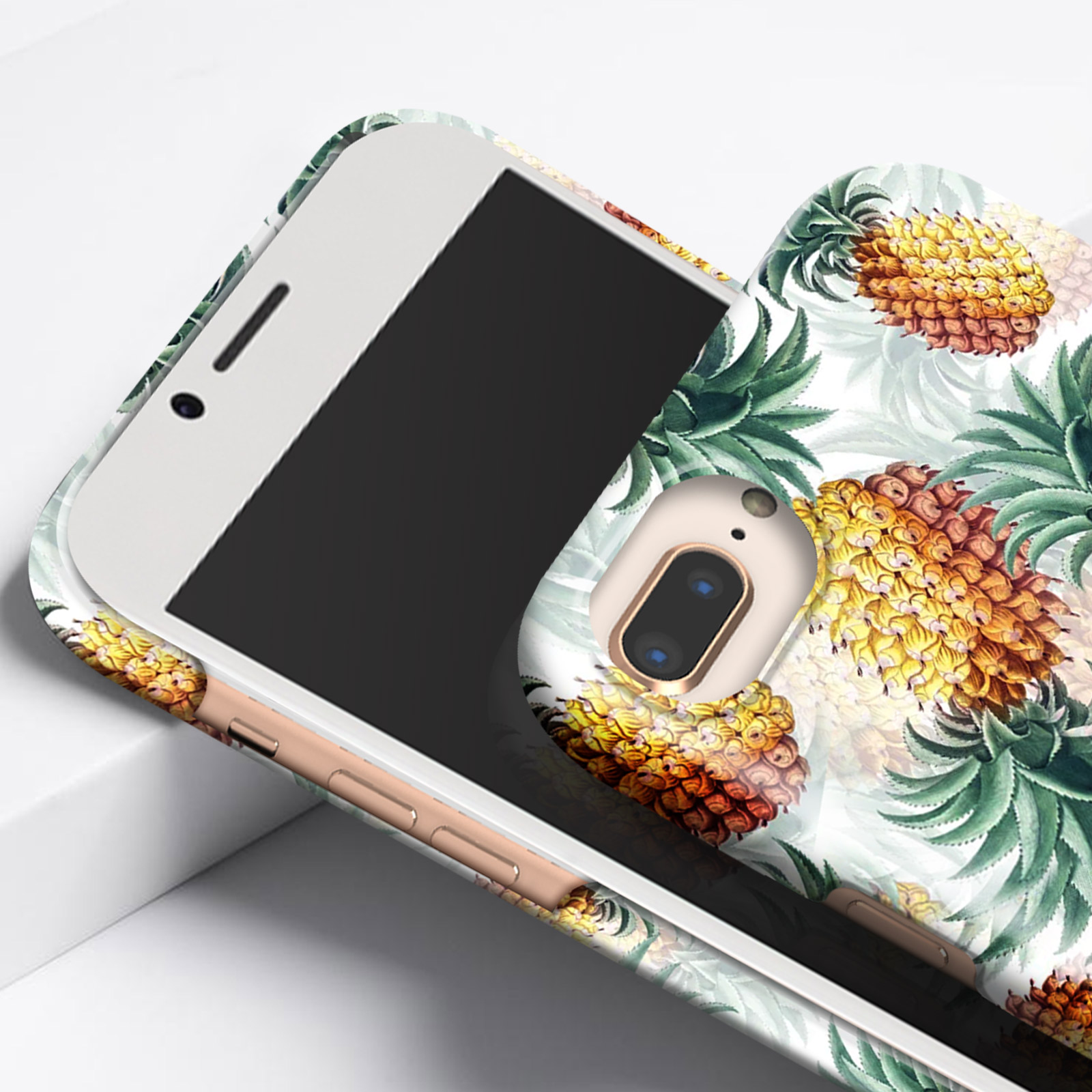 Custodia per telefono con motivo ananas su sfondo bianco. Telefono con schermo nero.
