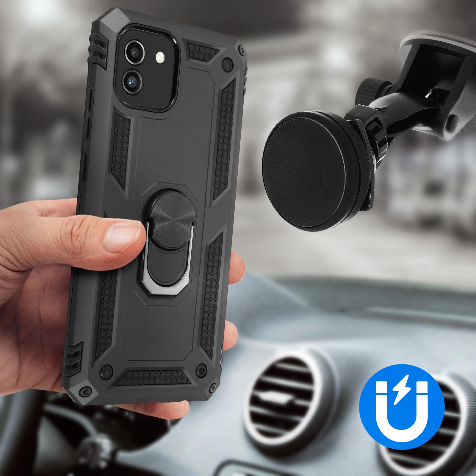 Hand hält schwarze Handyhülle an einer Telefonhalterung im Auto. Die Hülle hat einen Ring.