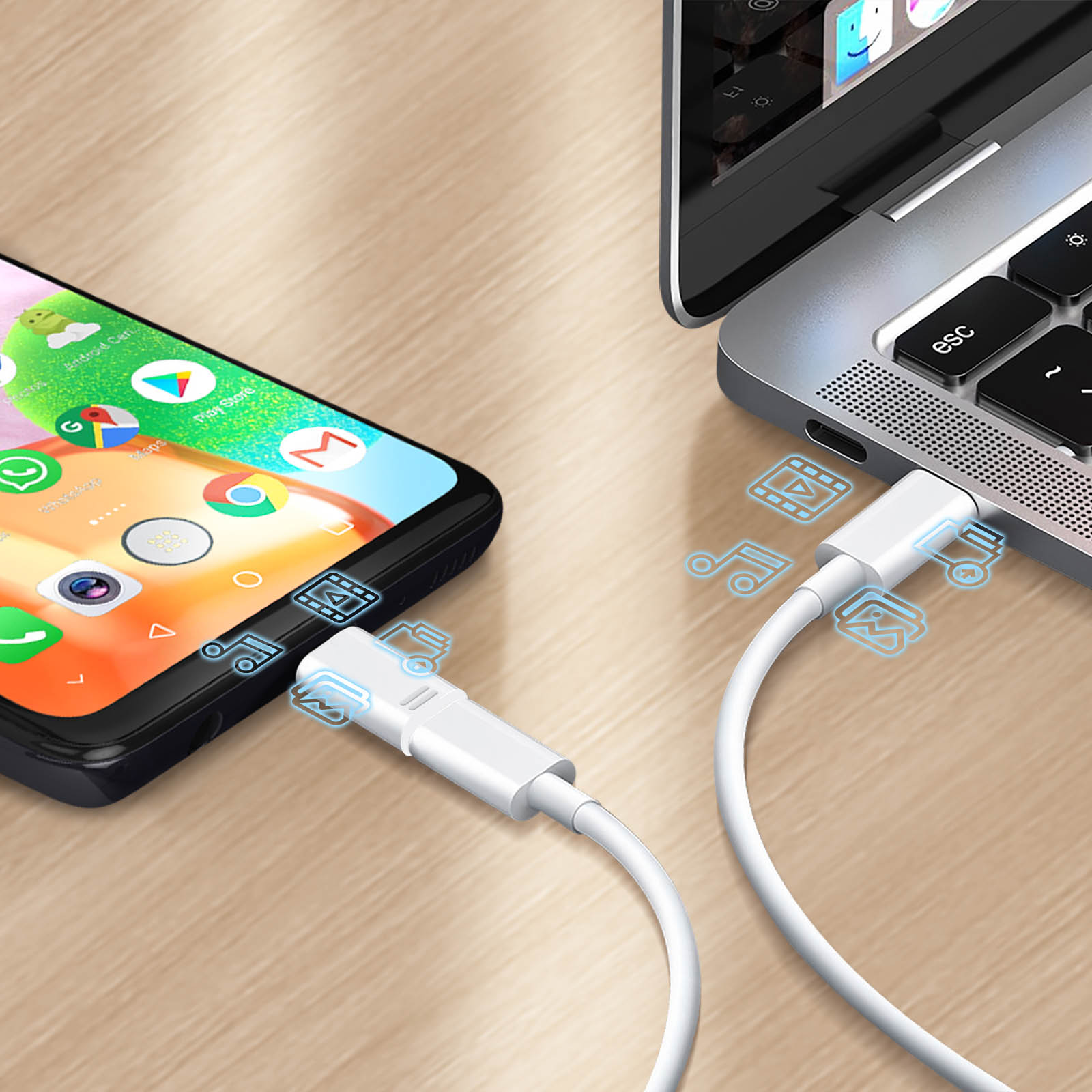 Telefon podłączony do laptopa kablem. Widoczne są również ikony pokazujące transfer danych.