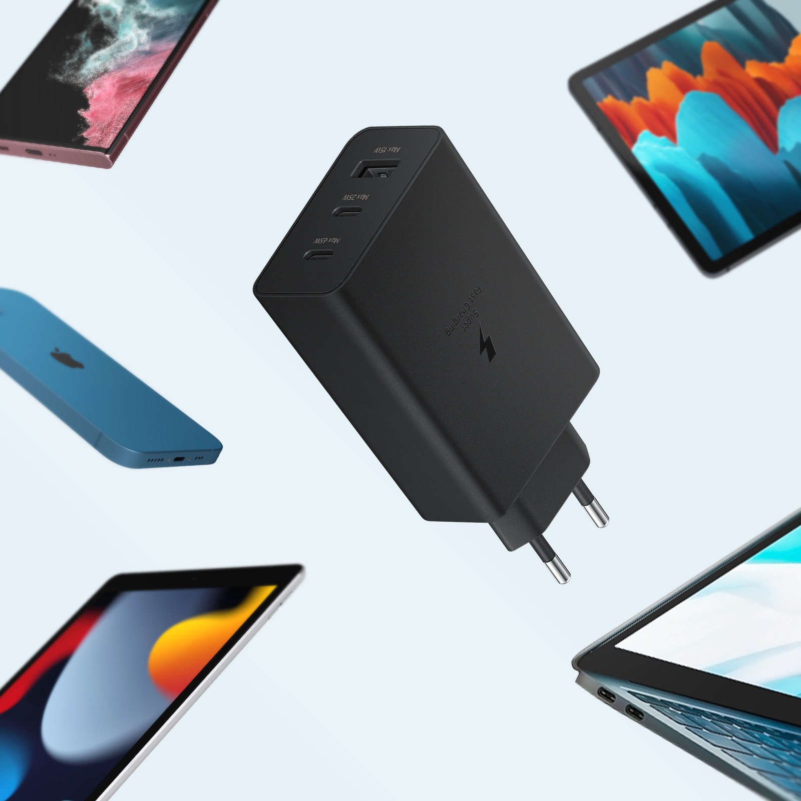 A black charger is surrounded by various electronic devices, including phones and tablets.