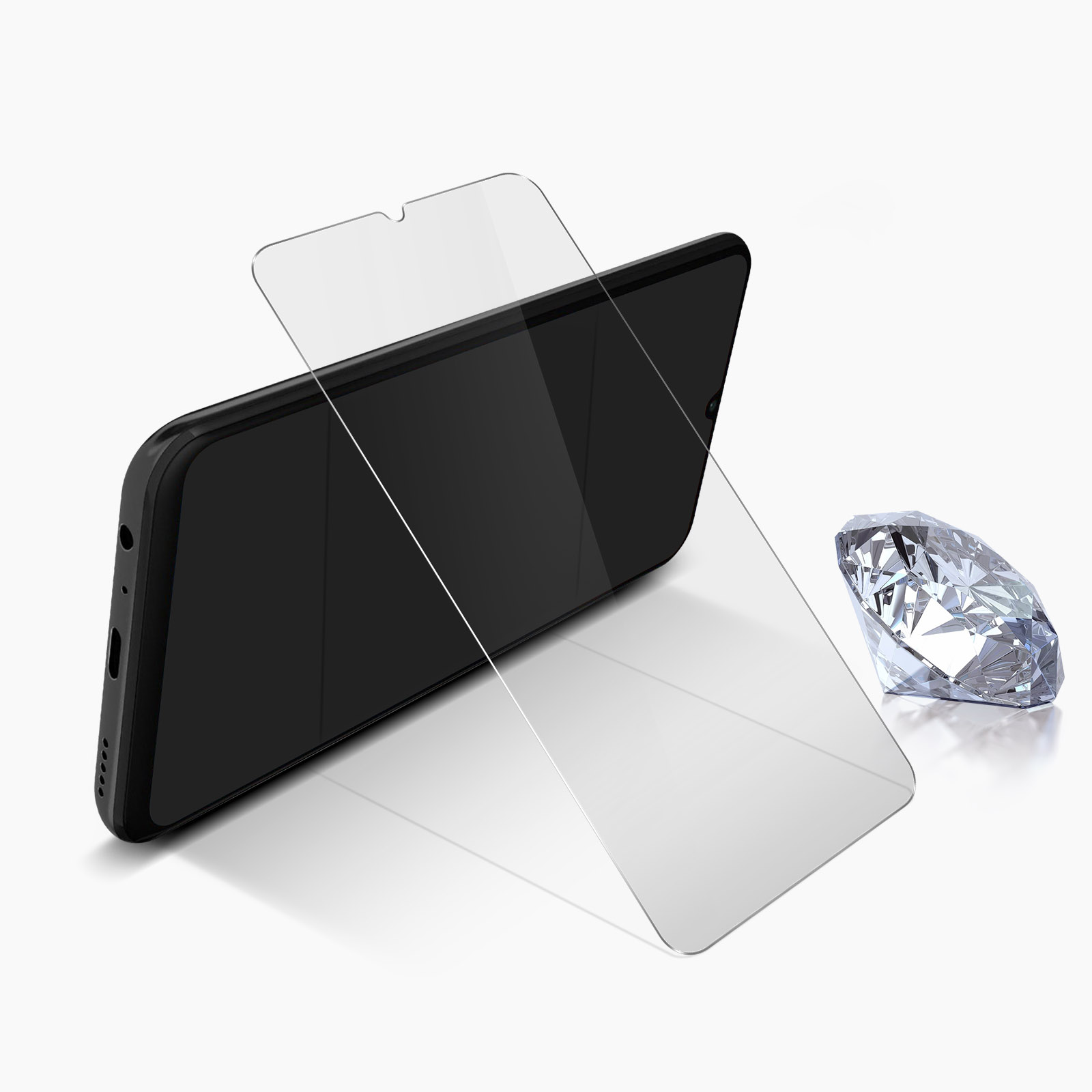 Un telefono nero con una protezione schermo e un diamante su una superficie bianca.
