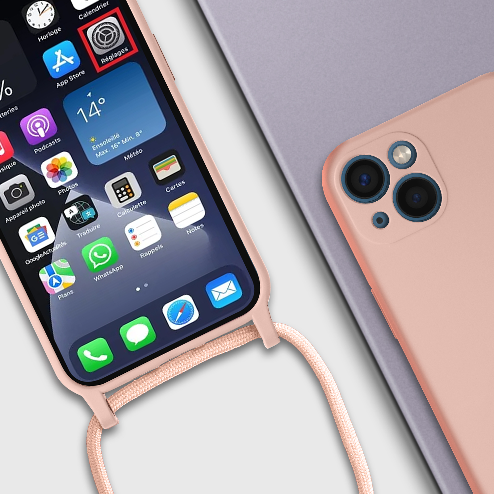 Un telefono con una custodia rosa e una cinghia, appoggiato su una superficie. Telefono sullo schermo.