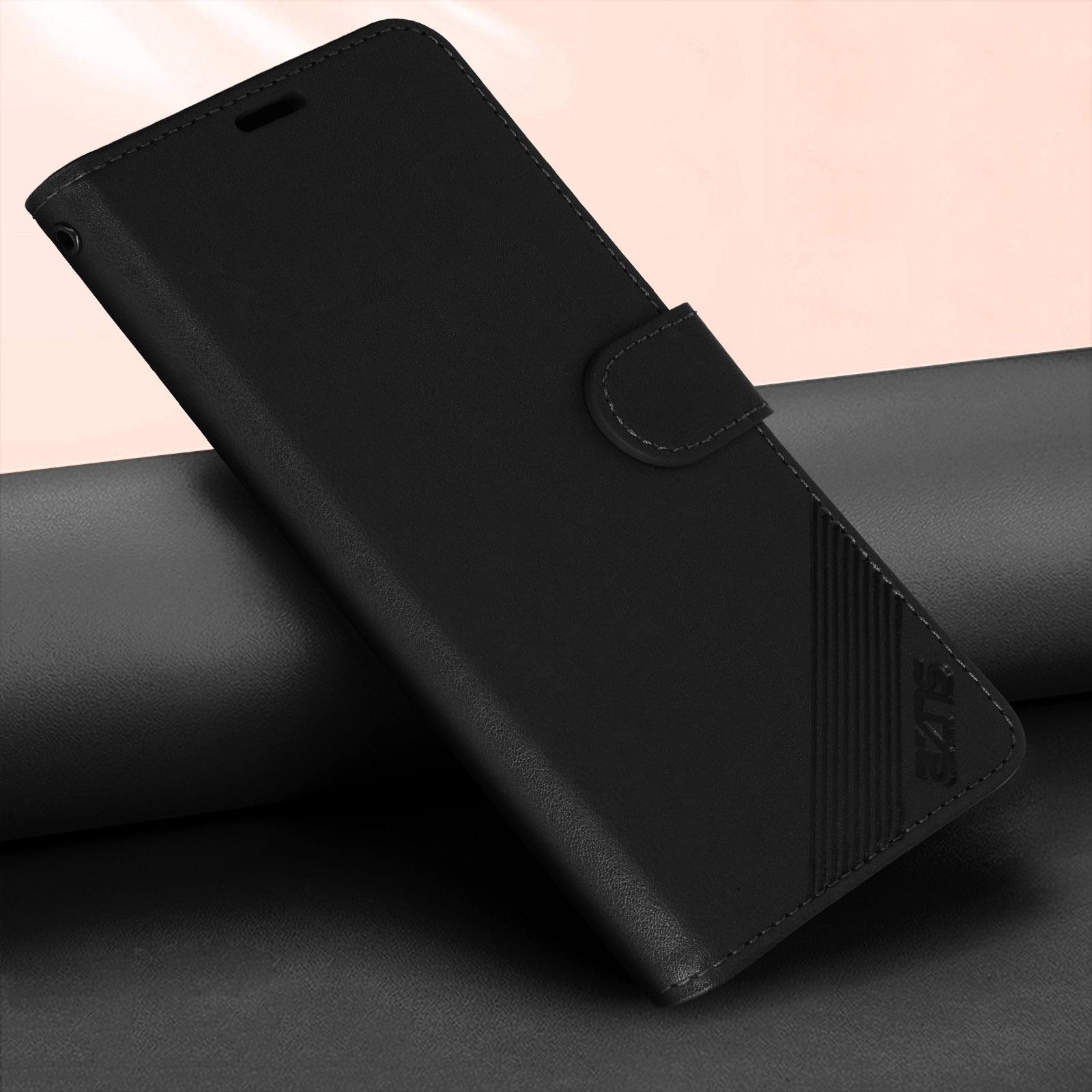 Custodia nera per telefono. Superficie strutturata e chiusura magnetica.