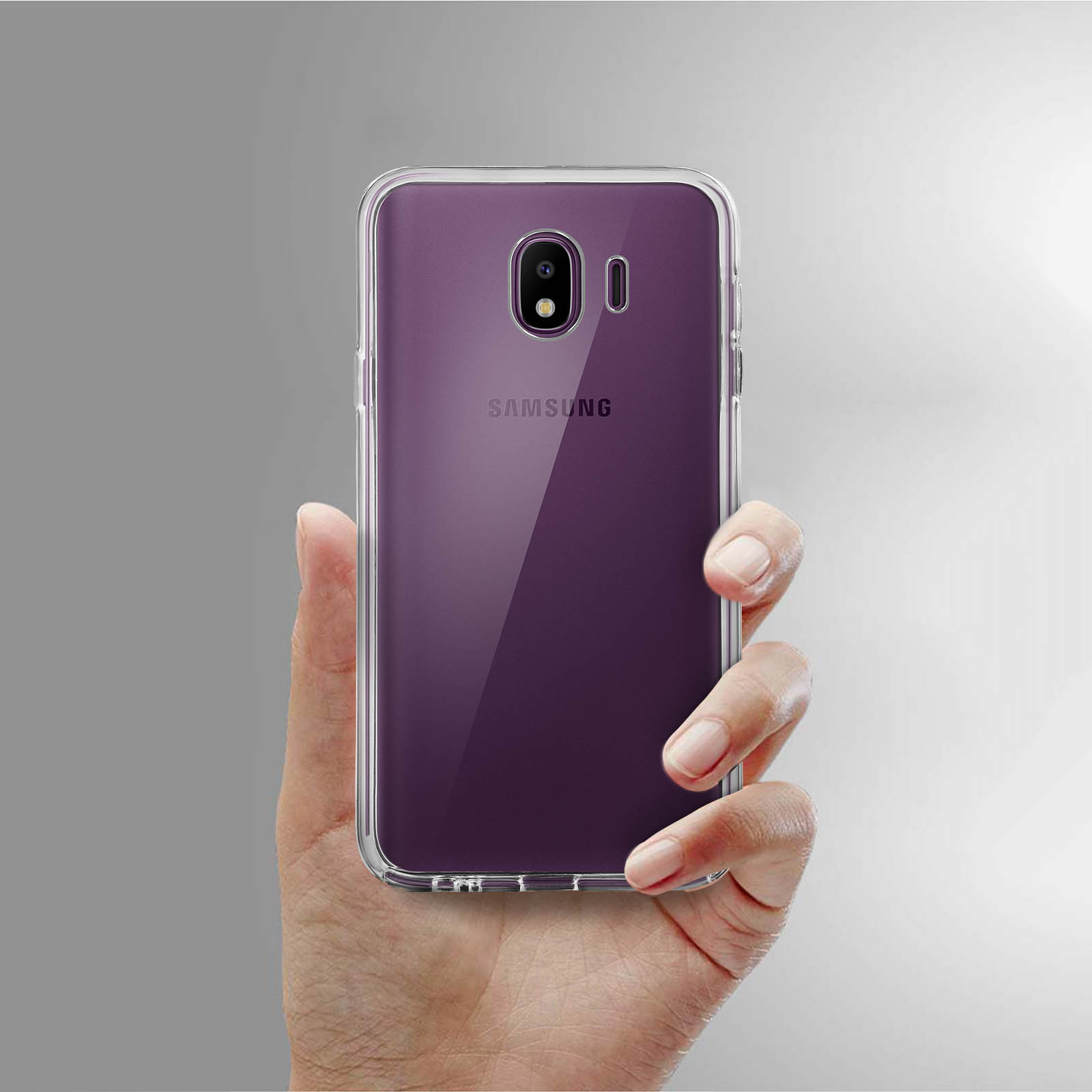 Mano che tiene un telefono in una custodia trasparente con schermo viola. Mostra il logo Samsung.