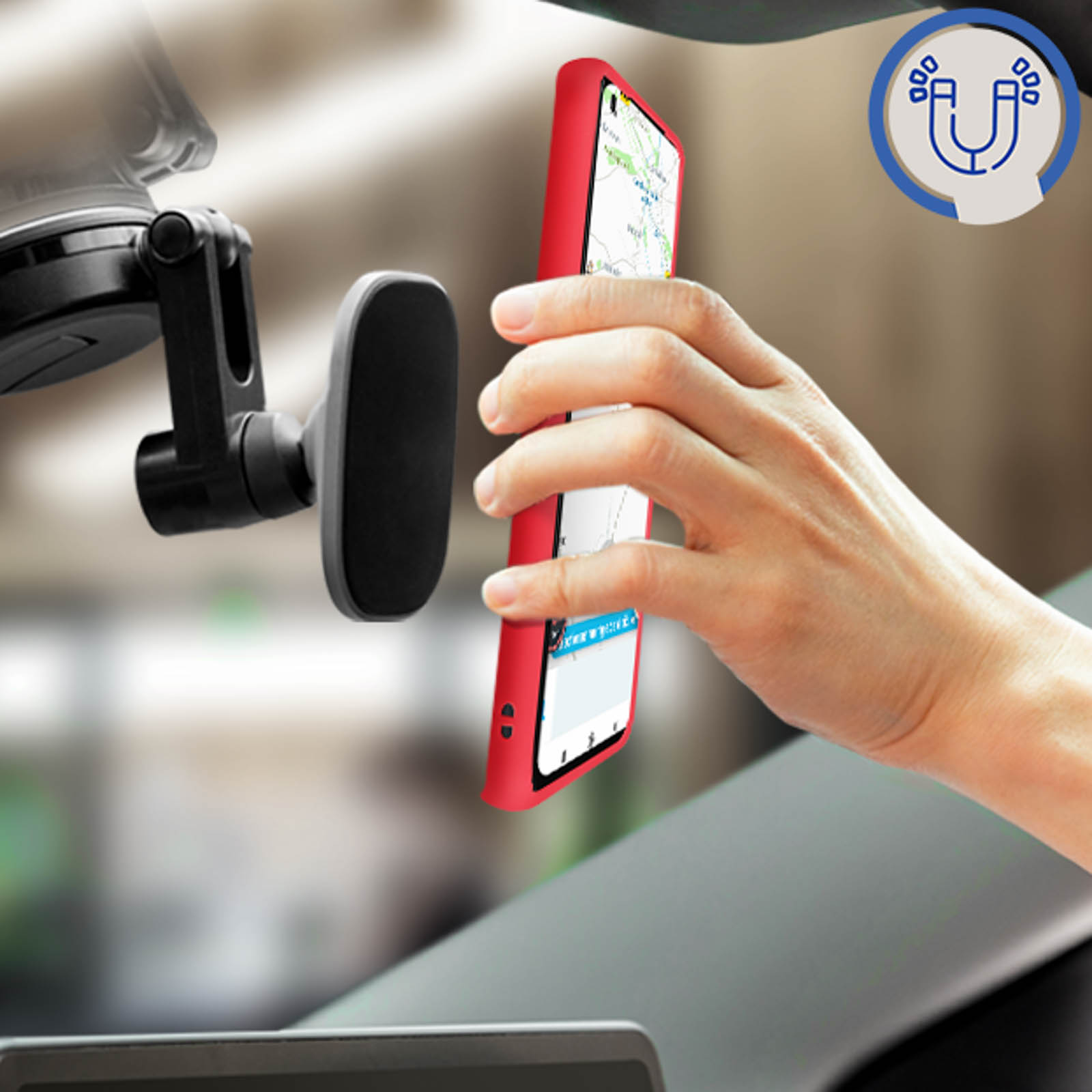 Un telefono rosso tenuto in auto con un supporto per telefono.