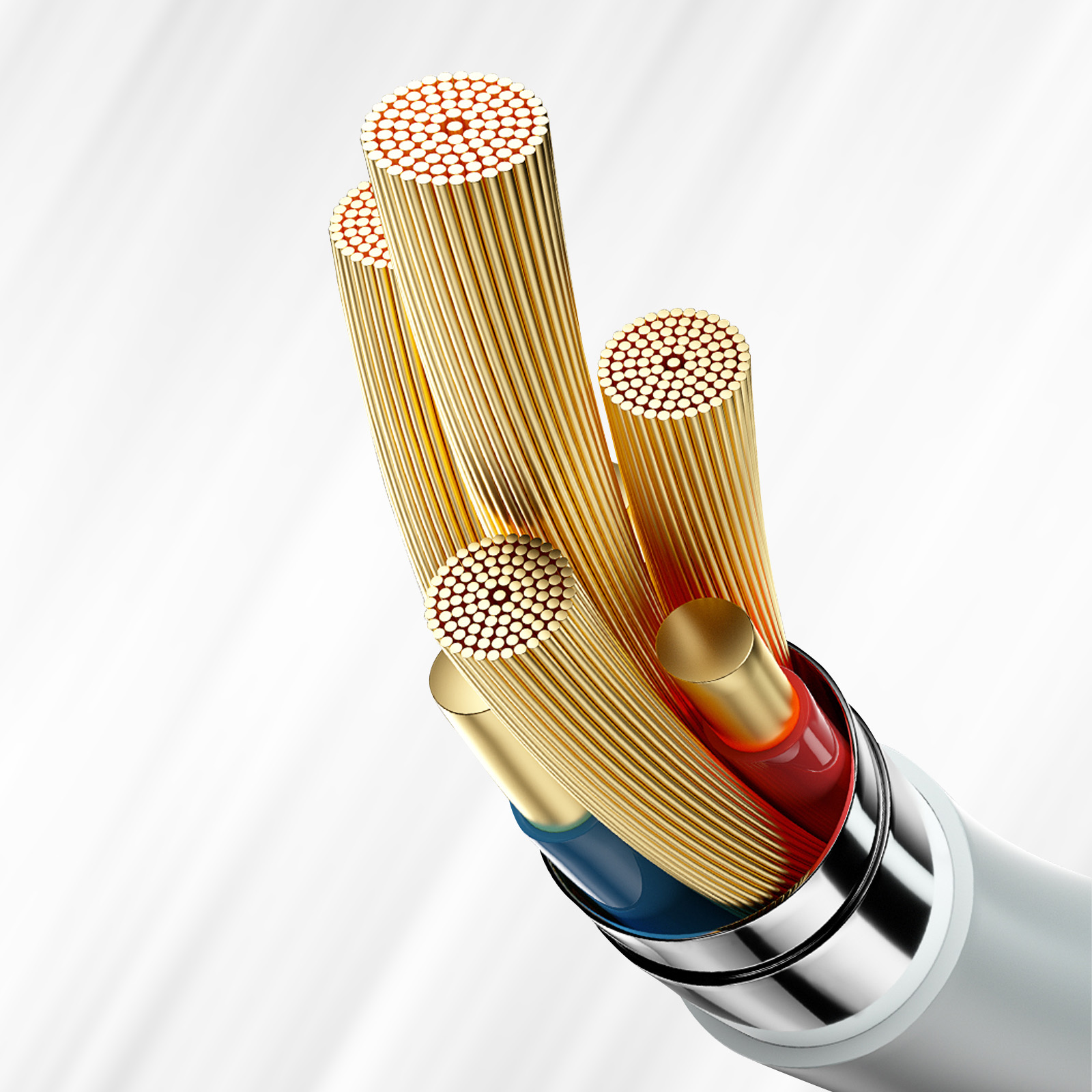 Zbliżenie przeciętego kabla. Złote przewody z czerwoną i niebieską izolacją w srebrnej obudowie.