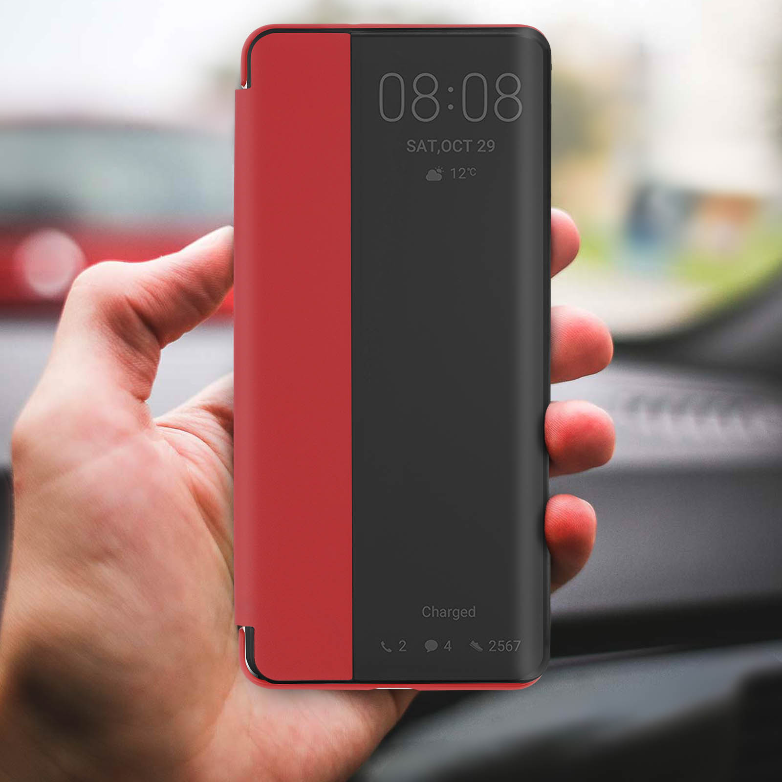 Telefono con custodia rossa e nera. Lo schermo mostra ora e data.