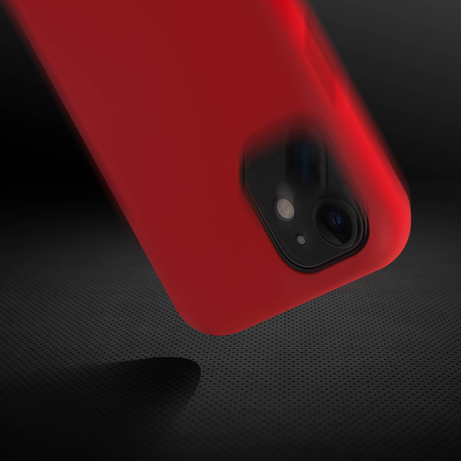 Coque de téléphone rouge avec caméra. Fond noir avec motif pointillé.