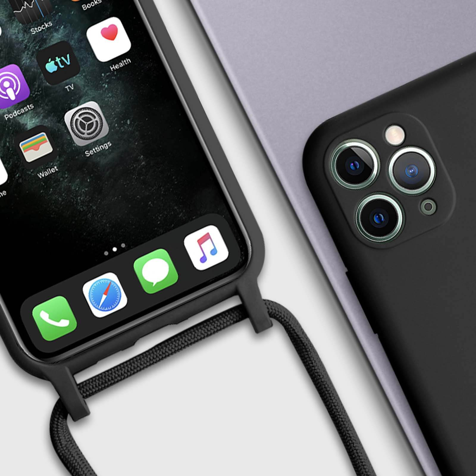 Gros plan d'un téléphone noir avec des applications, un cordon noir et un autre téléphone.