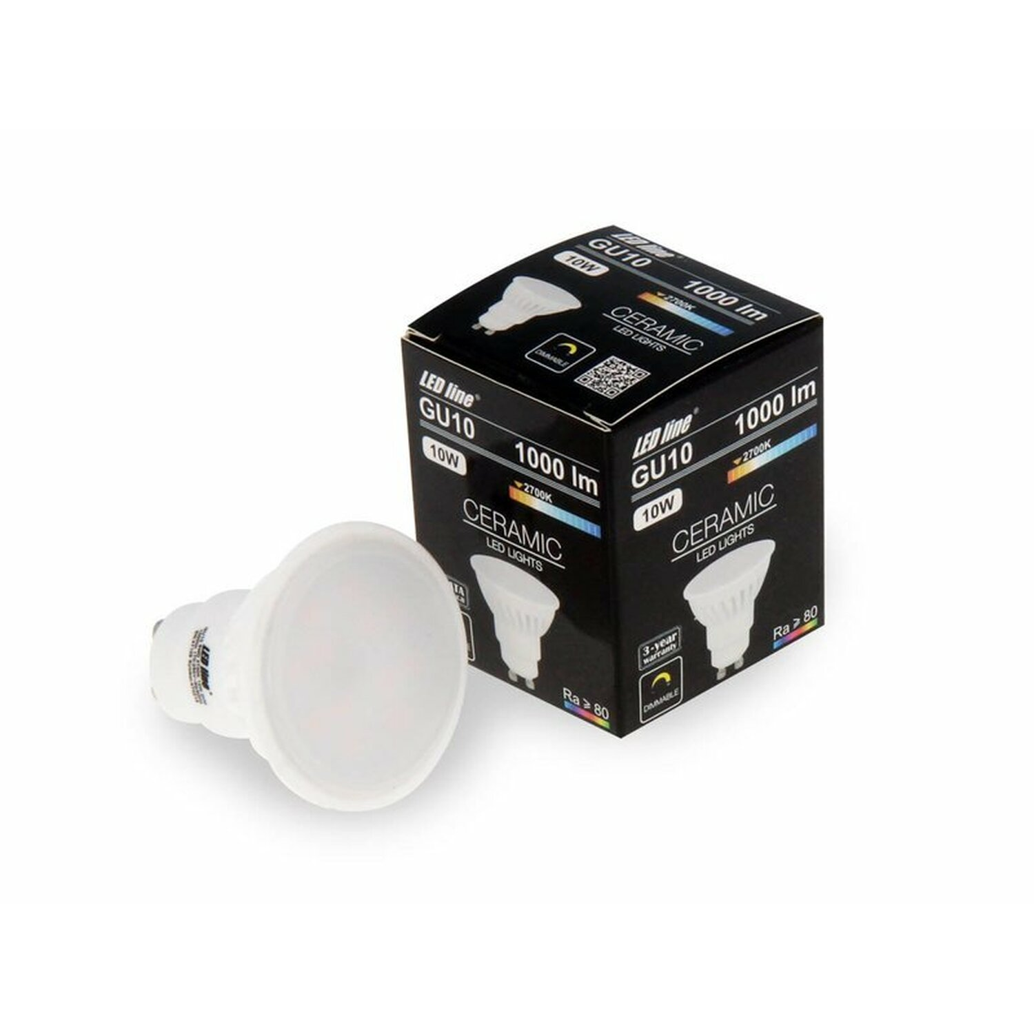 Eine Glühbirne und ihre Verpackung. Auf der Verpackung steht GU10, 10W, 1000 Im.