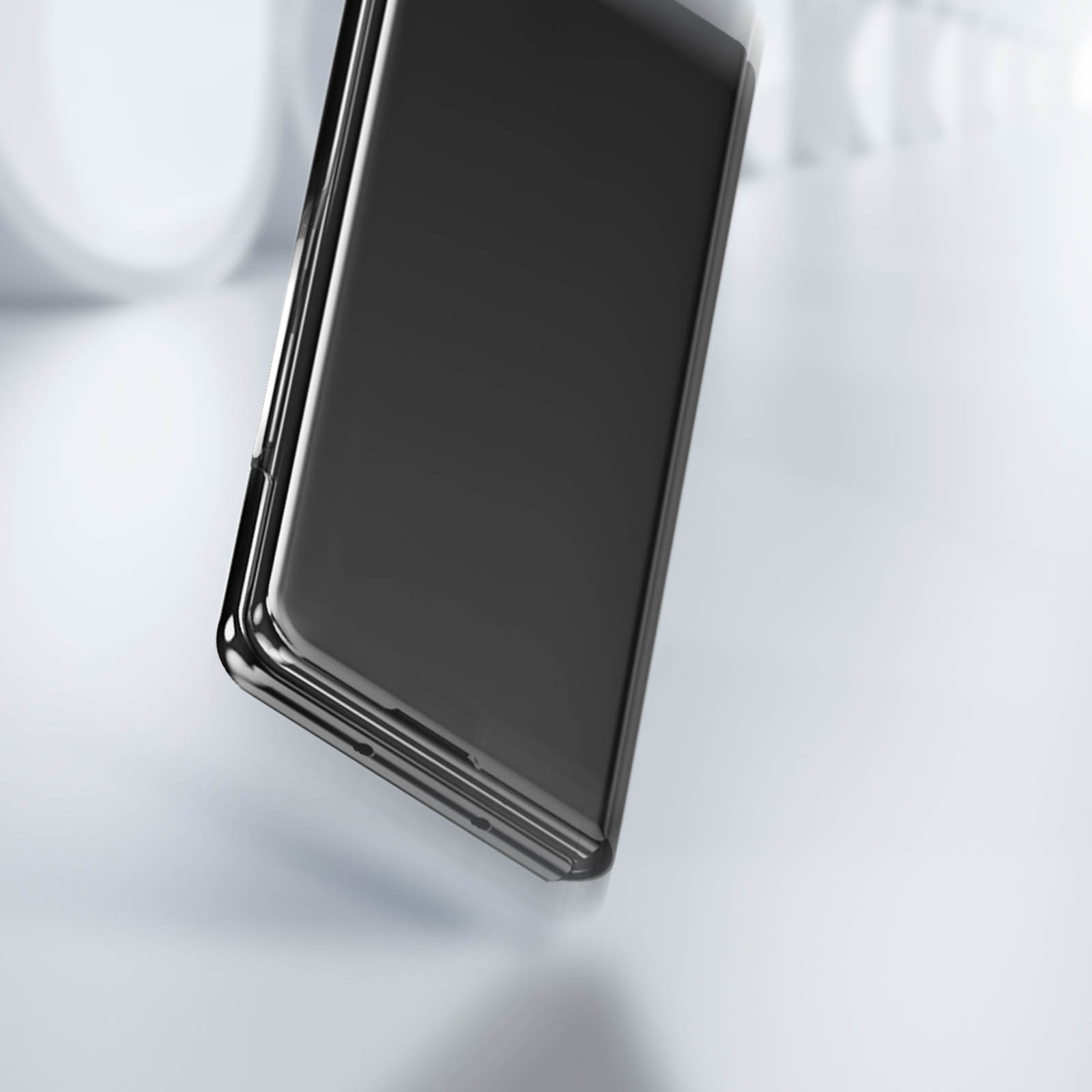 Telefono nero lucido, leggermente angolato. È su sfondo bianco e grigio chiaro.