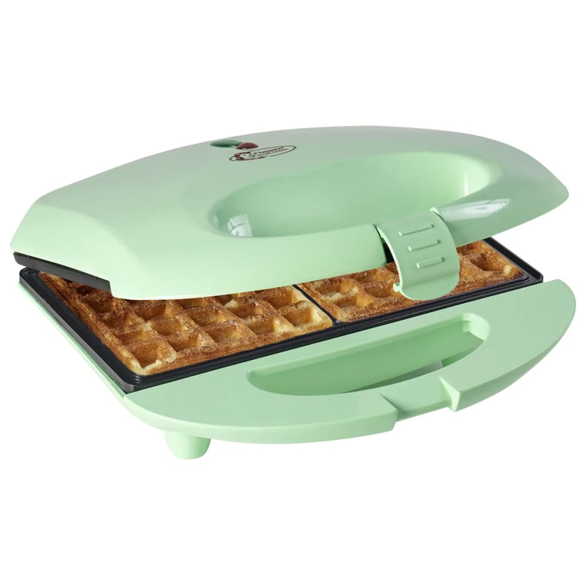 Macchina per waffle verde, aperta, con waffle all'interno. Manico verde. I waffle sono dorati.