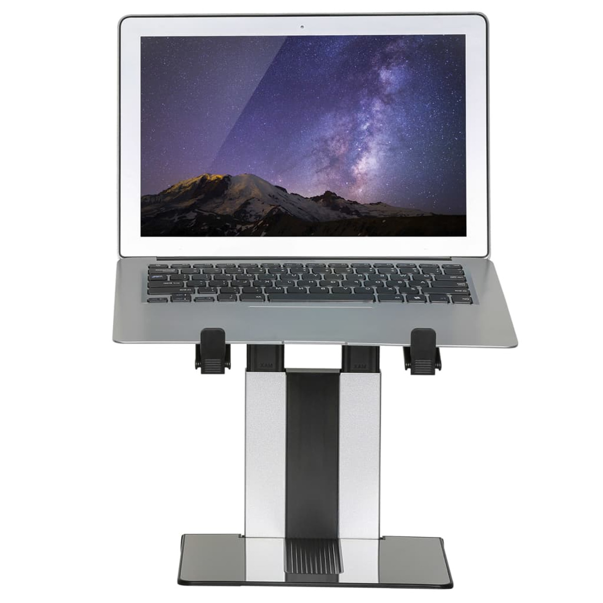 A laptop on a silver and black stand, with a starry background.