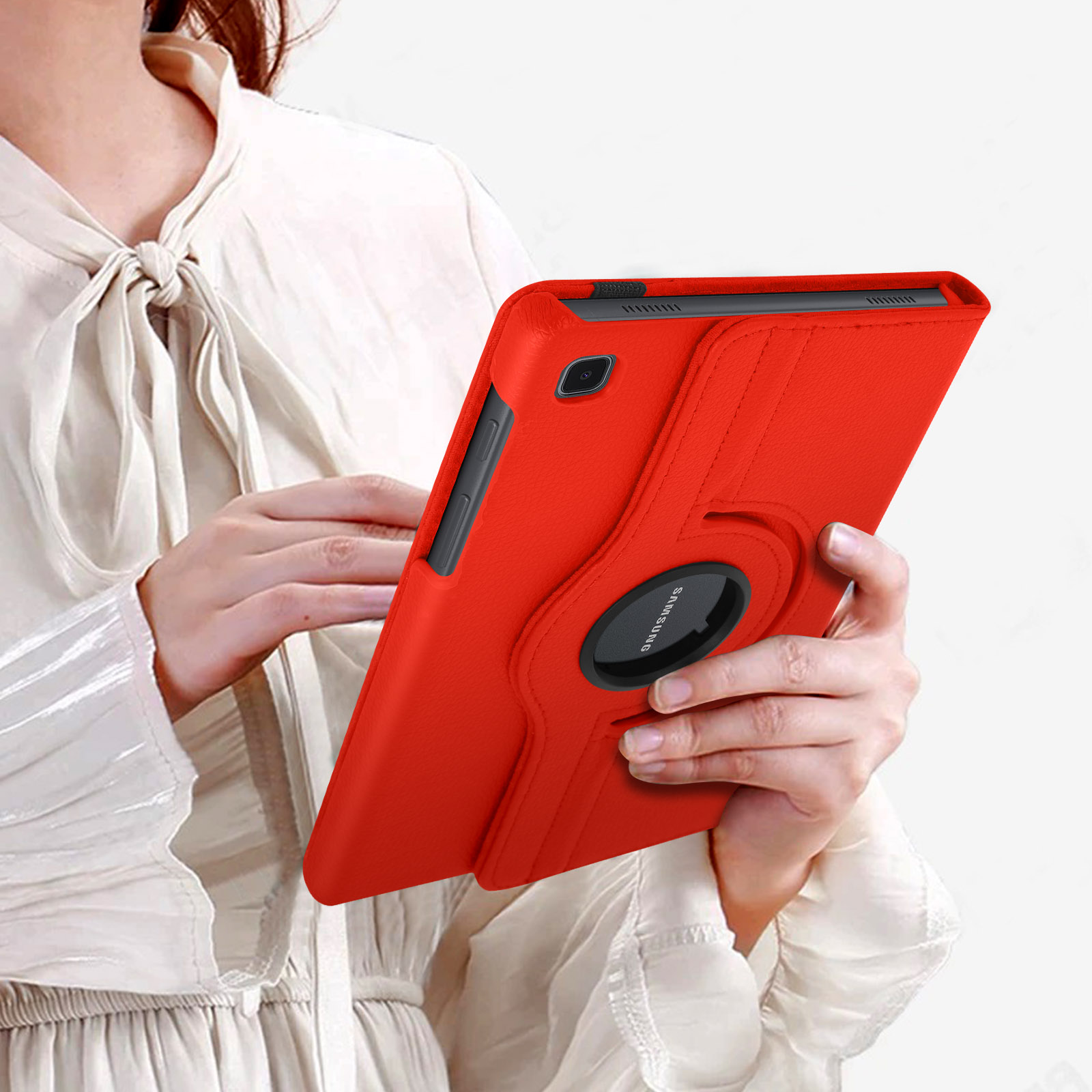 Una persona che tiene una custodia per tablet rossa con un anello di supporto attaccato.