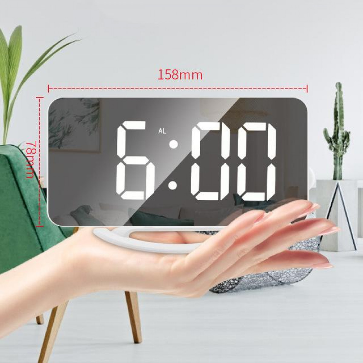 Eine Hand hält eine Digitaluhr, die 6:00 Uhr anzeigt. Abmessungen und Maße sind angegeben.