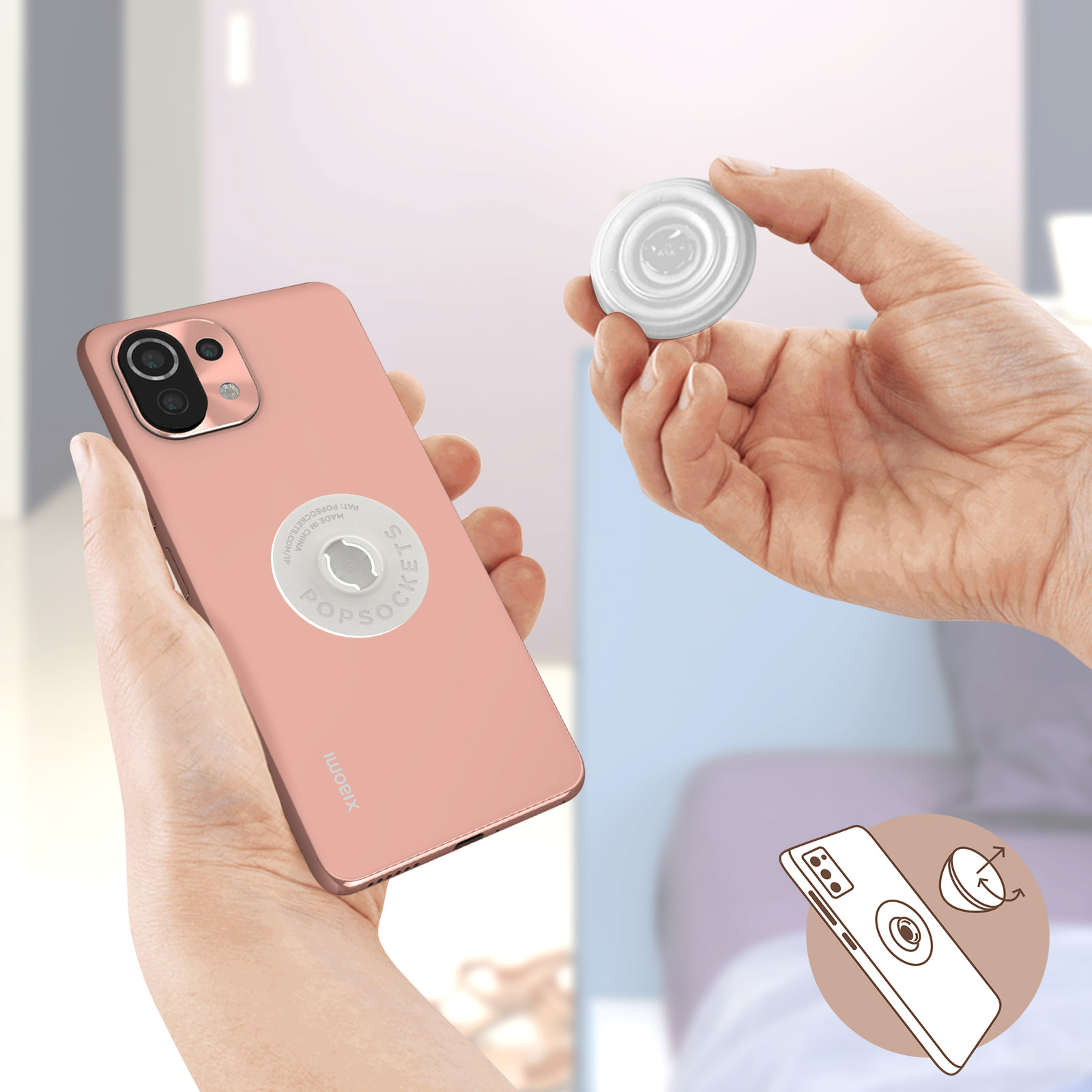 Eine Person hält ein Telefon mit einem PopSocket und einen weiteren PopSocket.