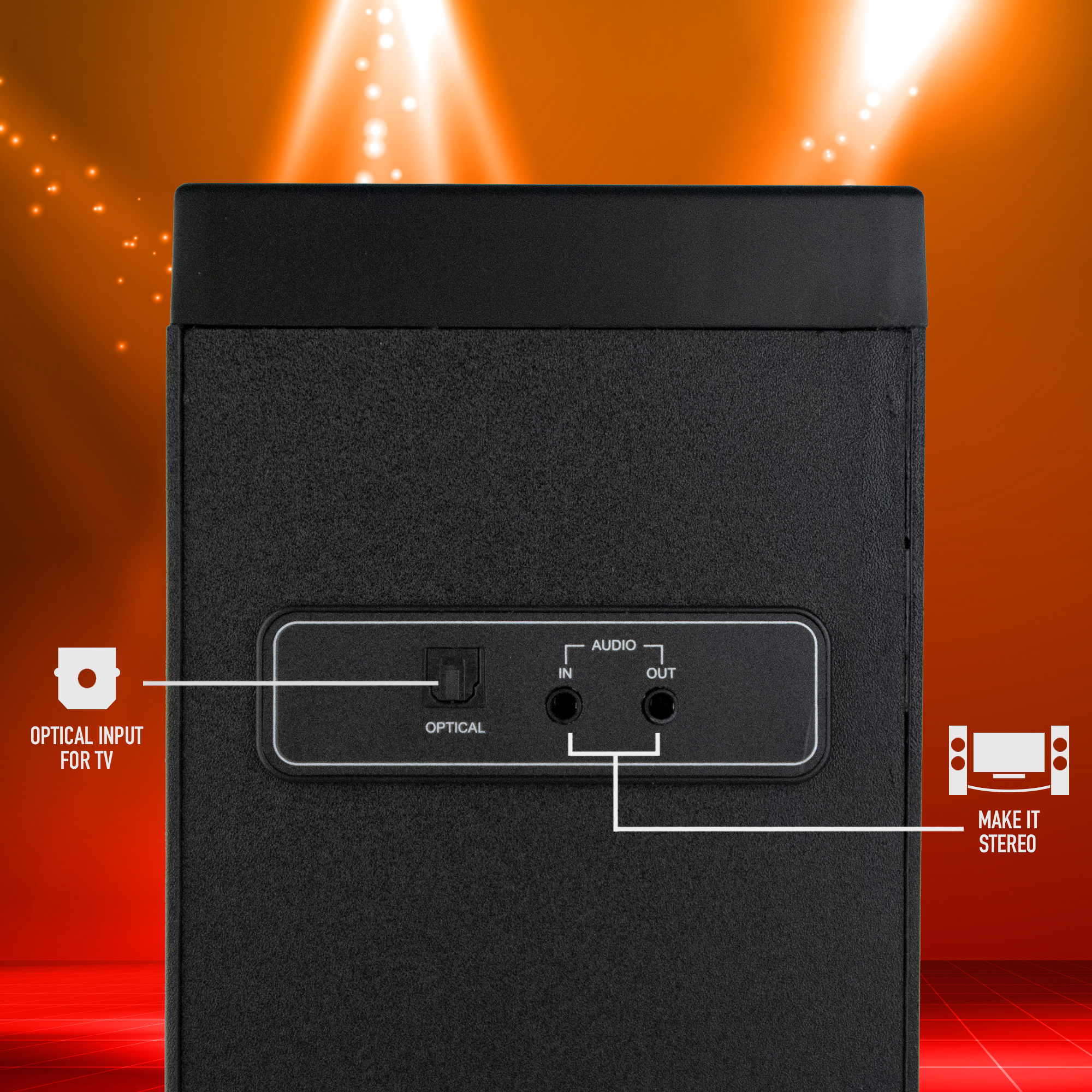 Altavoz negro con etiquetas de entrada/salida de audio. Fondo naranja con efecto de foco.