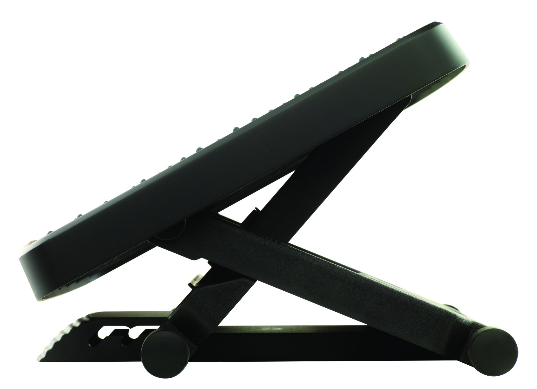 Black footrest with adjustable angle on a white background. Side view.