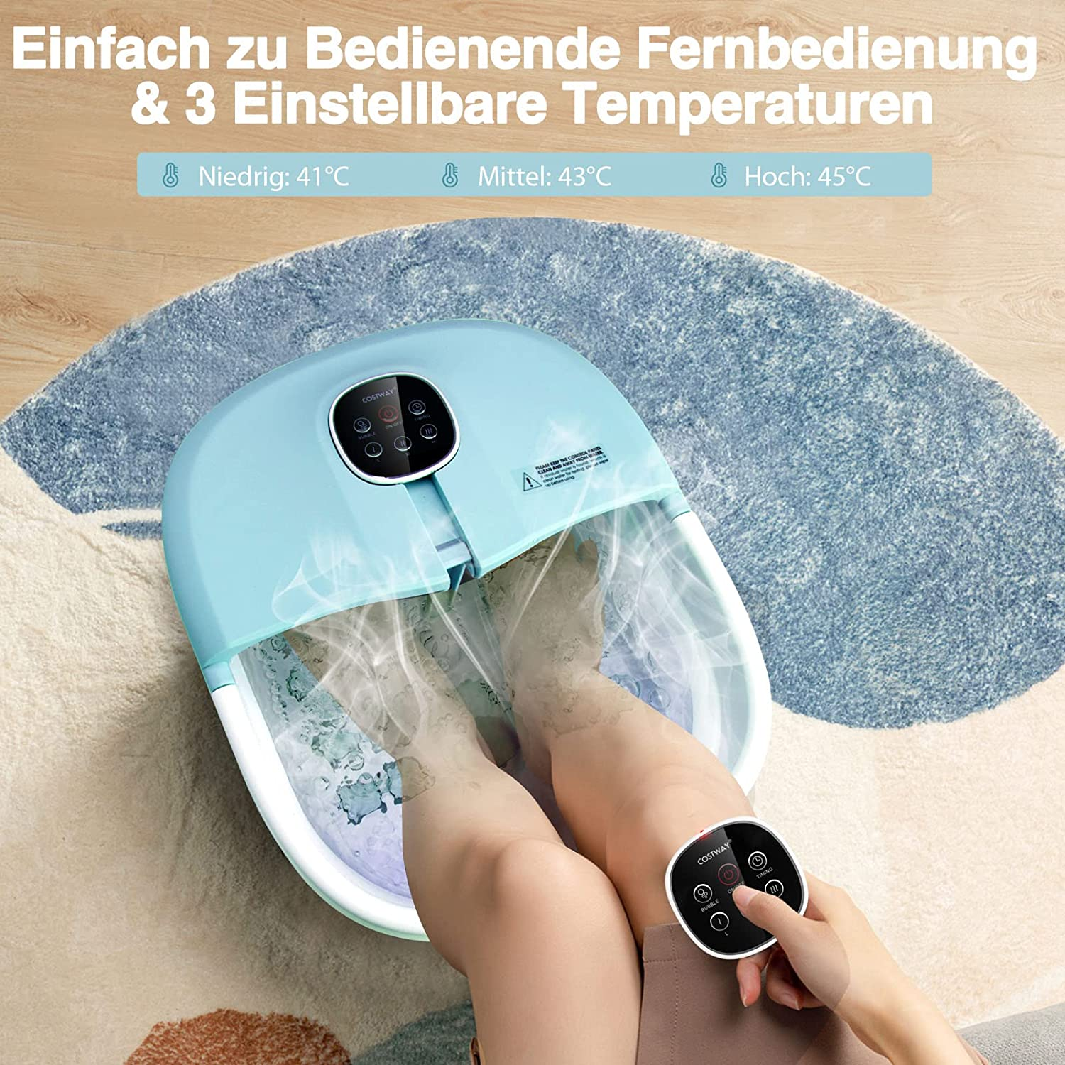 Die Füße einer Person in einem blauen Fußbad, mit Fernbedienung. Text zeigt drei Temperaturen.