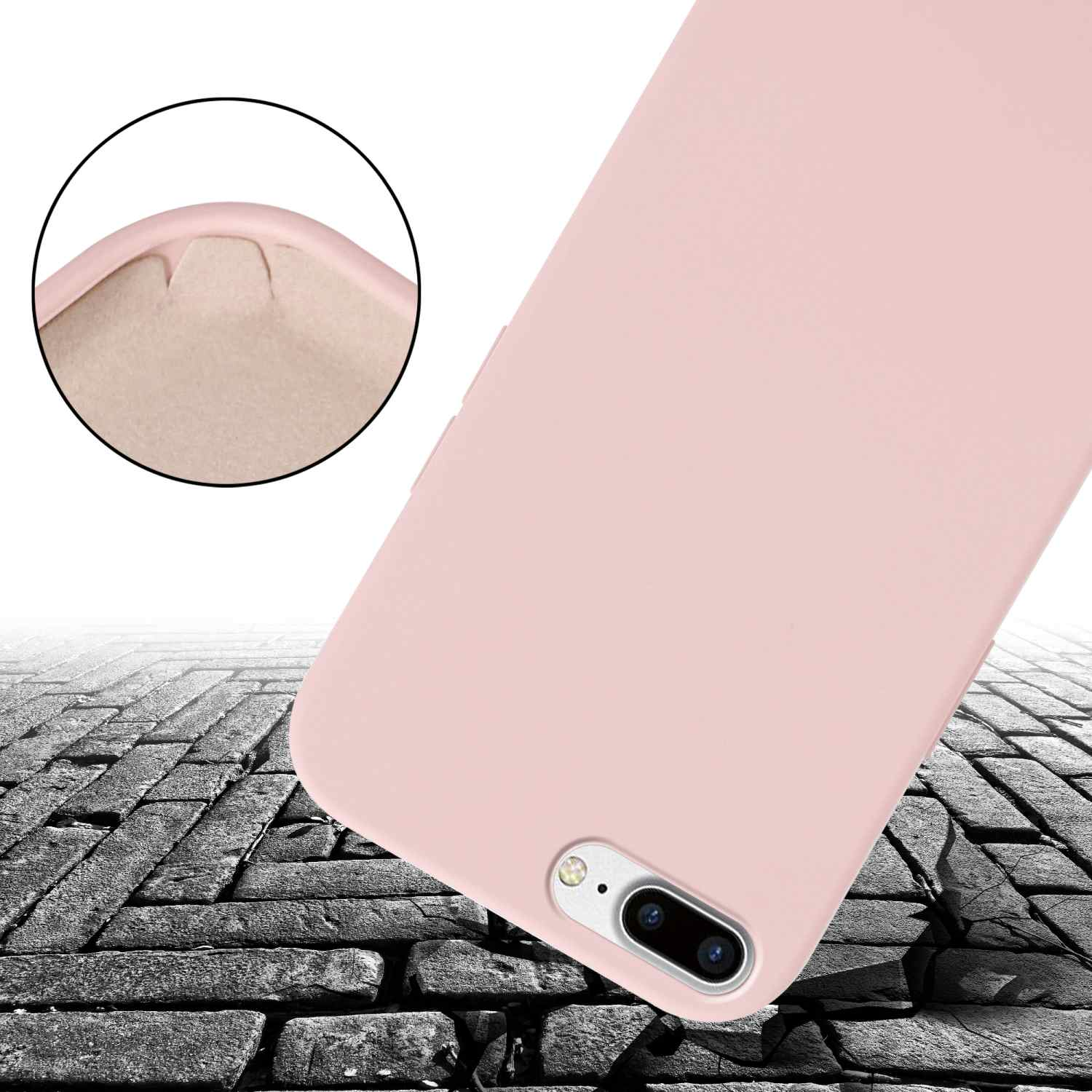 Custodia per telefono rosa su una superficie grigia ruvida. La custodia ha una fotocamera ed è leggermente inclinata.