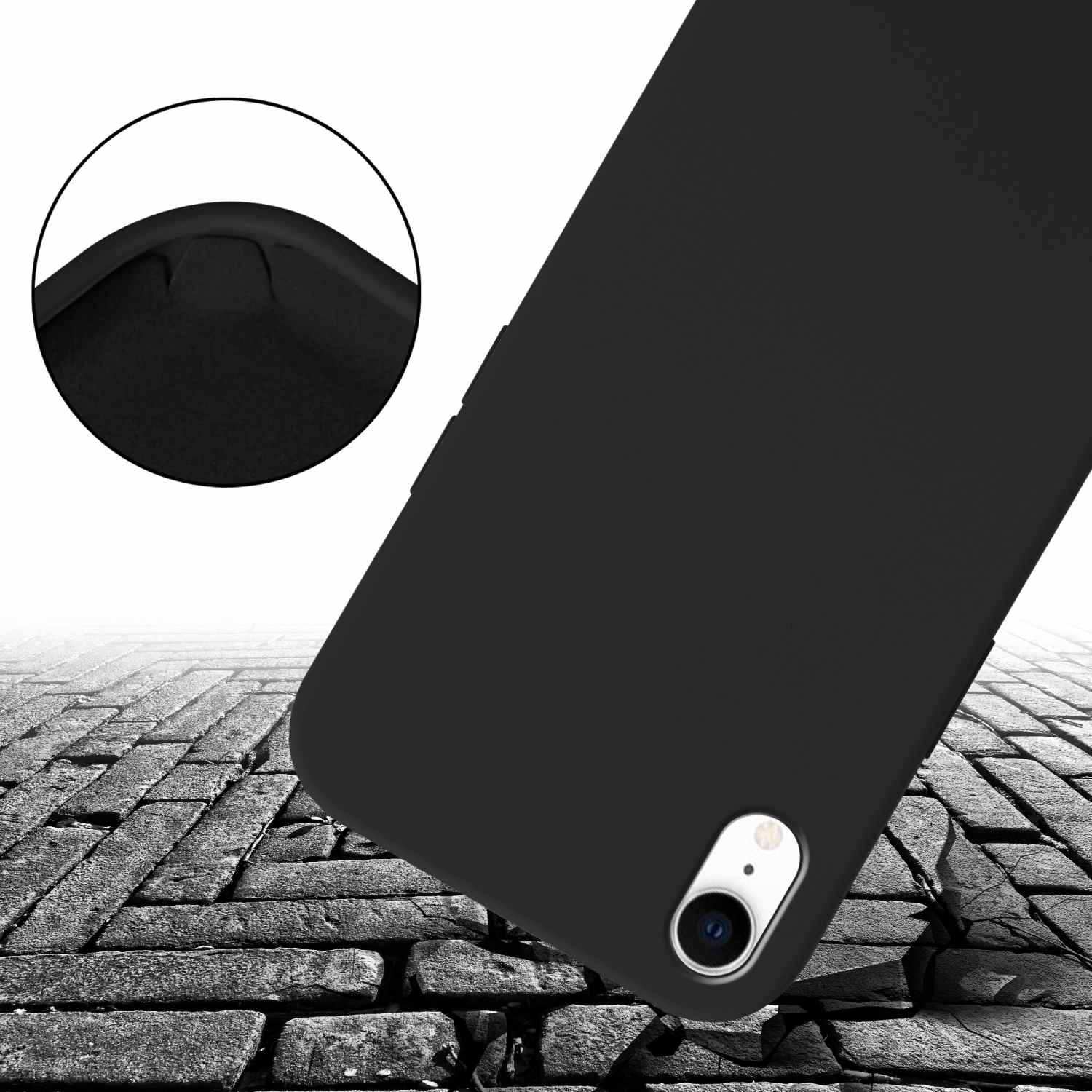 Custodia nera per telefono su superficie di pietra crepata. Dettaglio dell'angolo.