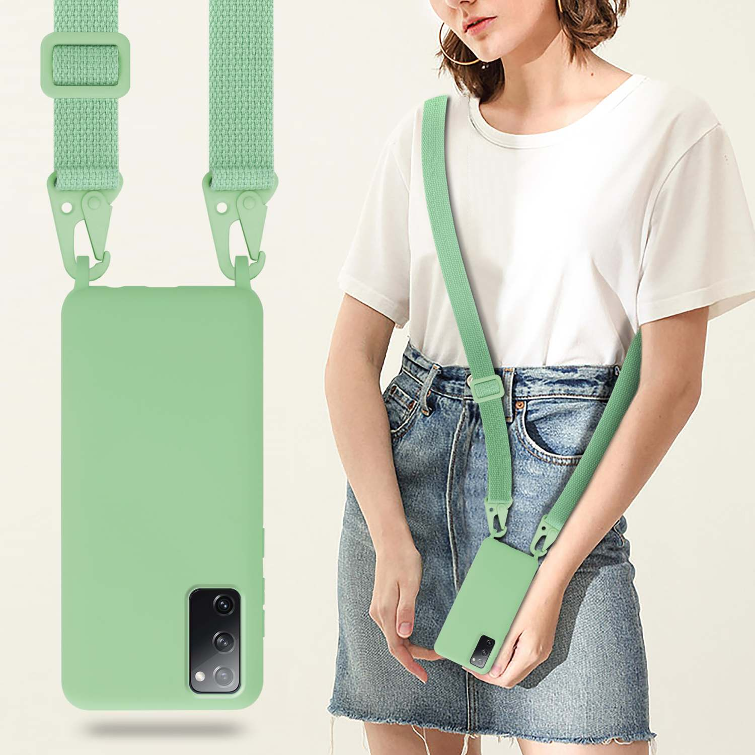 Una donna con custodia e cinturino per telefono verde menta. Indossa una camicia bianca e una gonna di jeans.