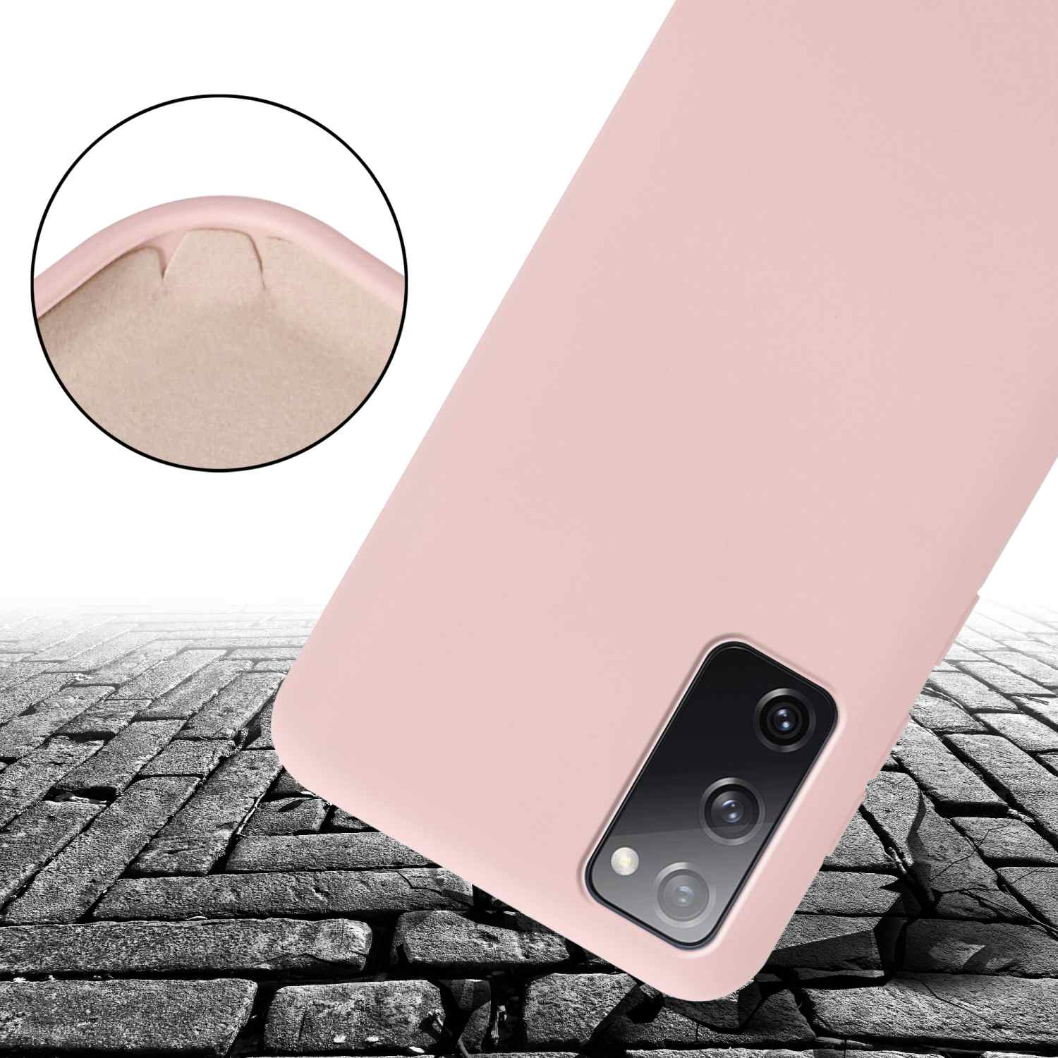 Una custodia rosa per telefono a terra, che mostra l'assorbimento degli urti.