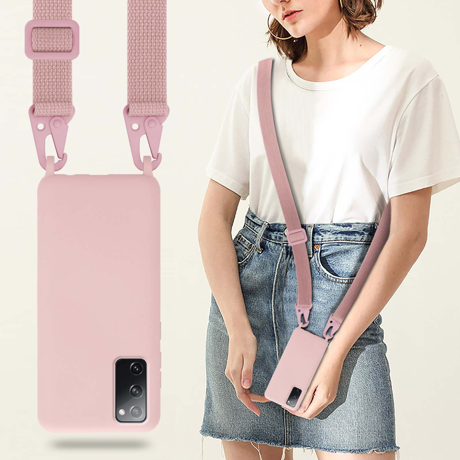 Una donna che indossa un cinturino per custodia del telefono rosa. Il telefono è in una custodia rosa. Sfondo bianco.