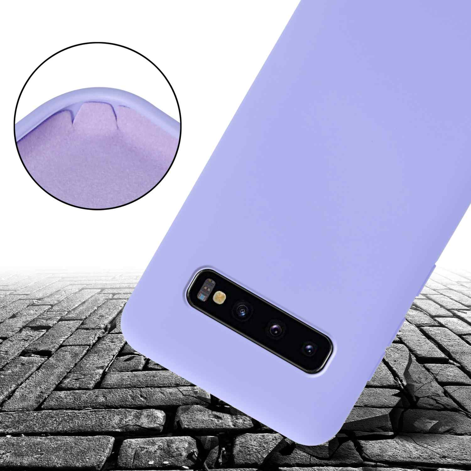 Custodia viola per telefono con angolo danneggiato su superficie di mattoni, che mostra i dettagli della fotocamera.