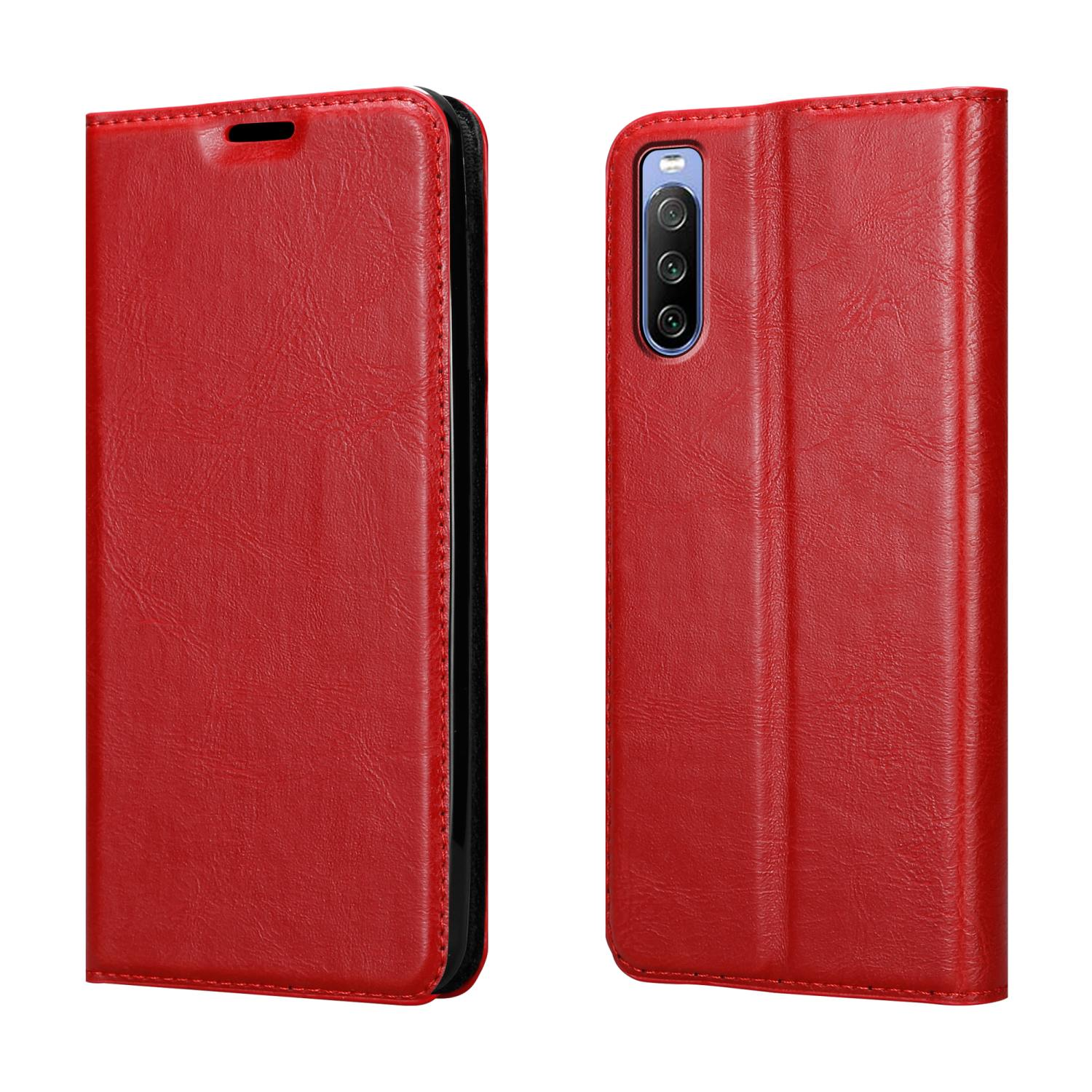 Una custodia rossa per telefono, chiusa e aperta, su sfondo bianco. La custodia è in stile portafoglio.