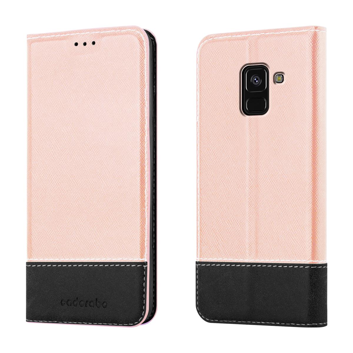 Una custodia per telefono rosa e nera. Lo schermo del telefono e un bordo nero sono visibili.