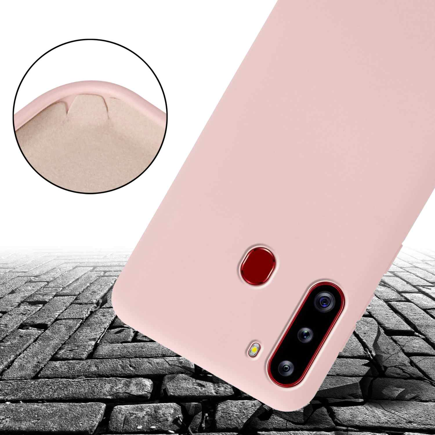 Primo piano di una custodia rosa con telefono all'interno, su mattoni.