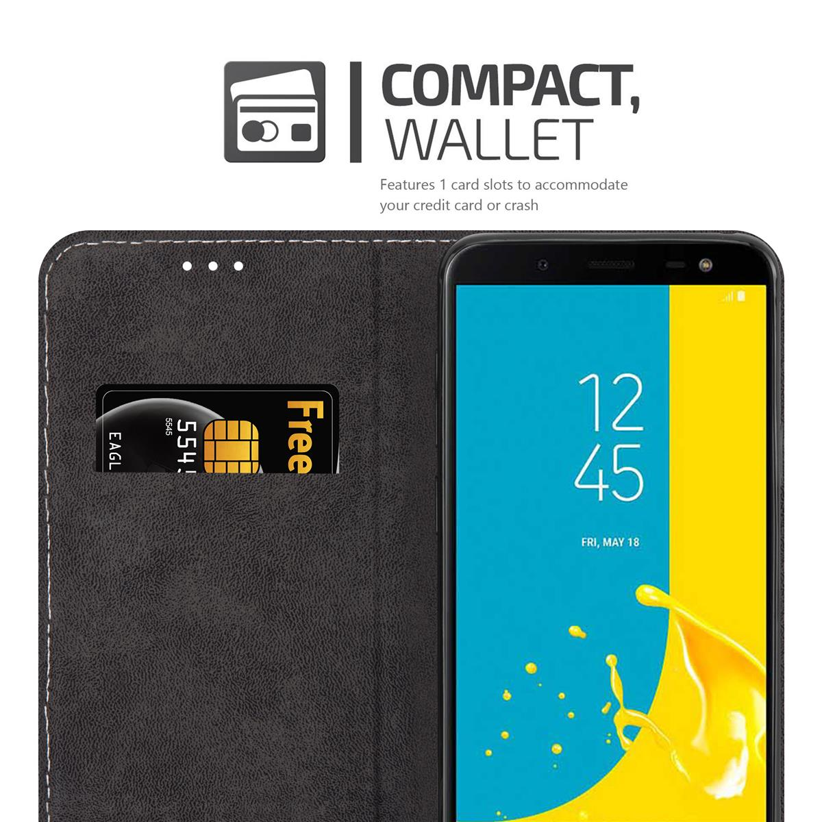 Custodia nera aperta, con carta e telefono con grafica blu e gialla, testo: Portafoglio.