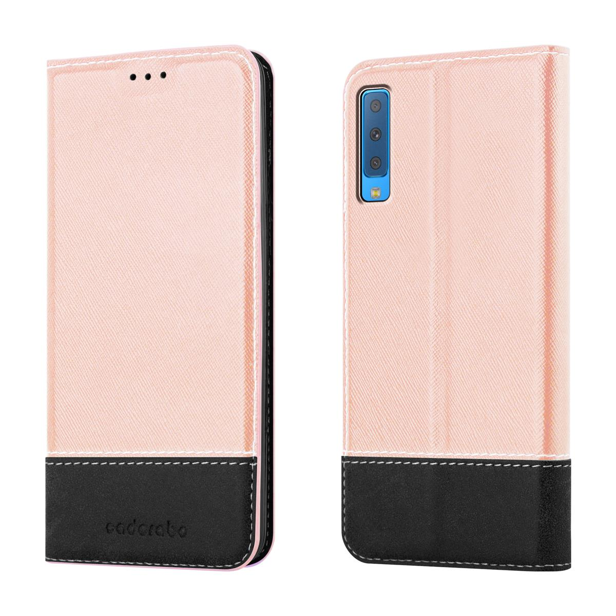 Custodia per telefono rosa e nera, aperta e chiusa. La custodia ha tre piccoli punti in alto.
